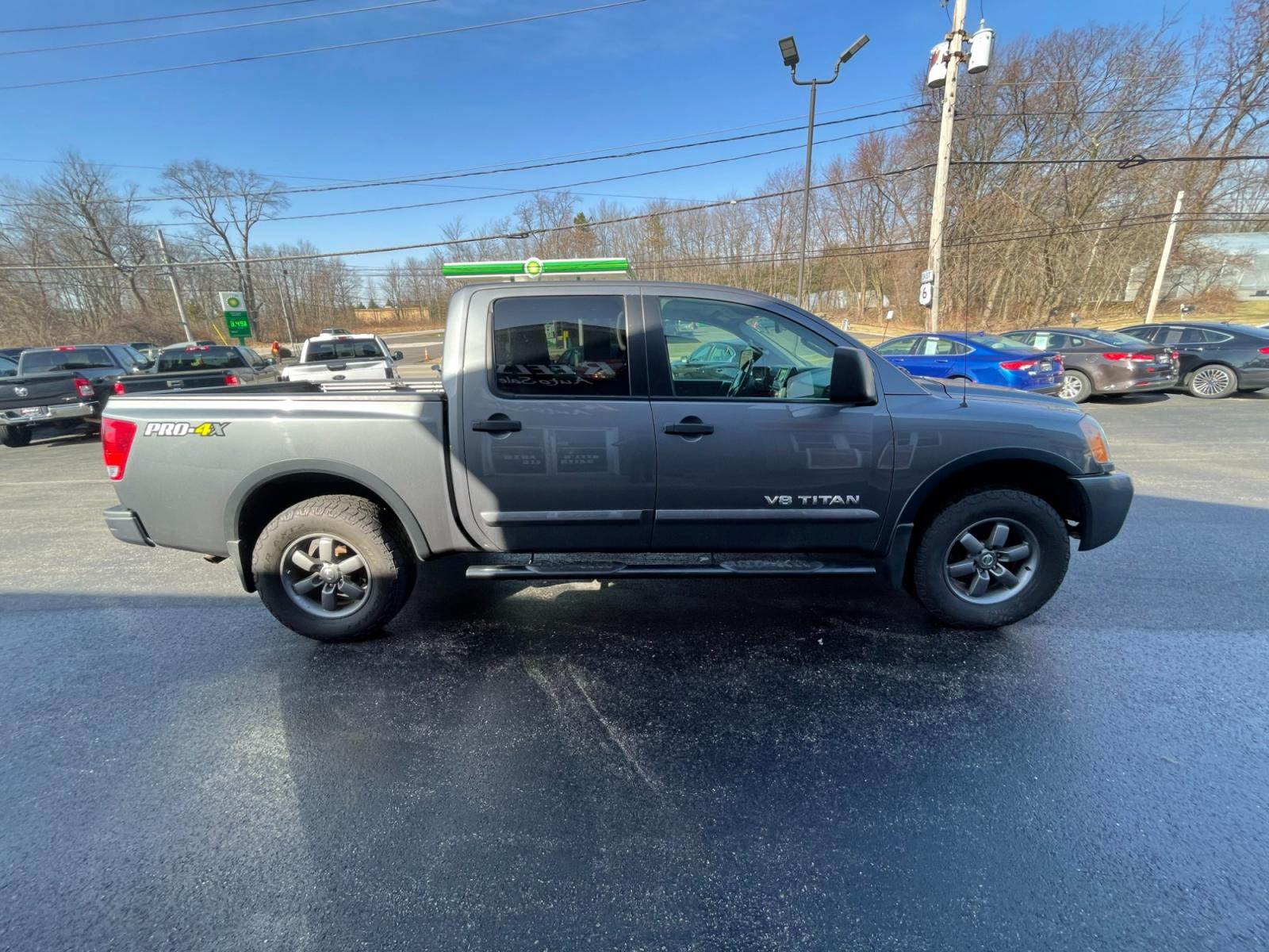 2013 Gray /Black Nissan Titan PRO-4X Crew Cab 4WD SWB (1N6AA0EC1DN) with an 5.6L V8 DOHC 32V engine, 5-Speed Automatic transmission, located at 547 E. Main St., Orwell, OH, 44076, (440) 437-5893, 41.535435, -80.847855 - 2013 Nissan Titan PRO-4X ---- Heated Leather Seats ---- Big Tow Package ---- 5.6L V8 ---- Fully Serviced and Recently Detailed ---- Reel's Auto Sales is located in both Chardon and Orwell Ohio. Financing available and trades welcome. Please call or text to confirm location, set an appointment or dis - Photo #5