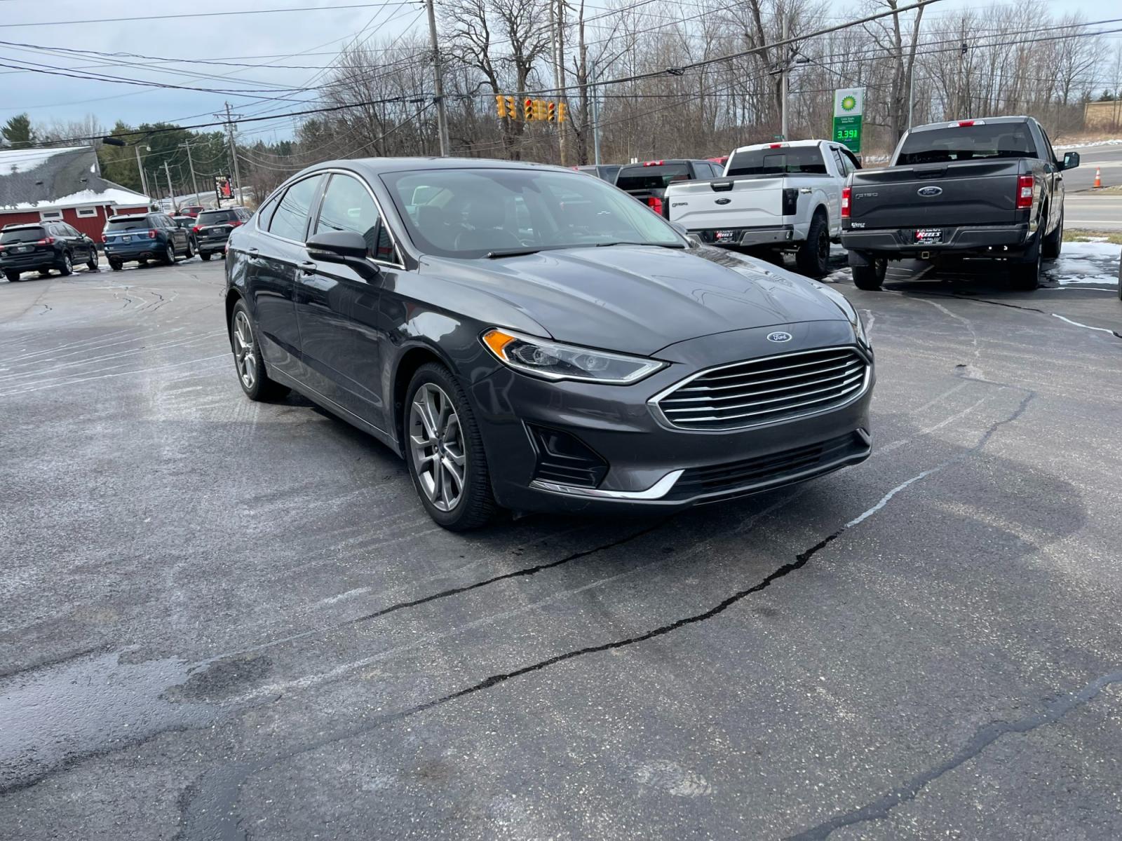 2019 Gray /Black Ford Fusion SEL (3FA6P0CD5KR) with an 1.5L I4 DOHC 16V TURBO engine, 6A transmission, located at 11115 Chardon Rd. , Chardon, OH, 44024, (440) 214-9705, 41.580246, -81.241943 - Photo #2
