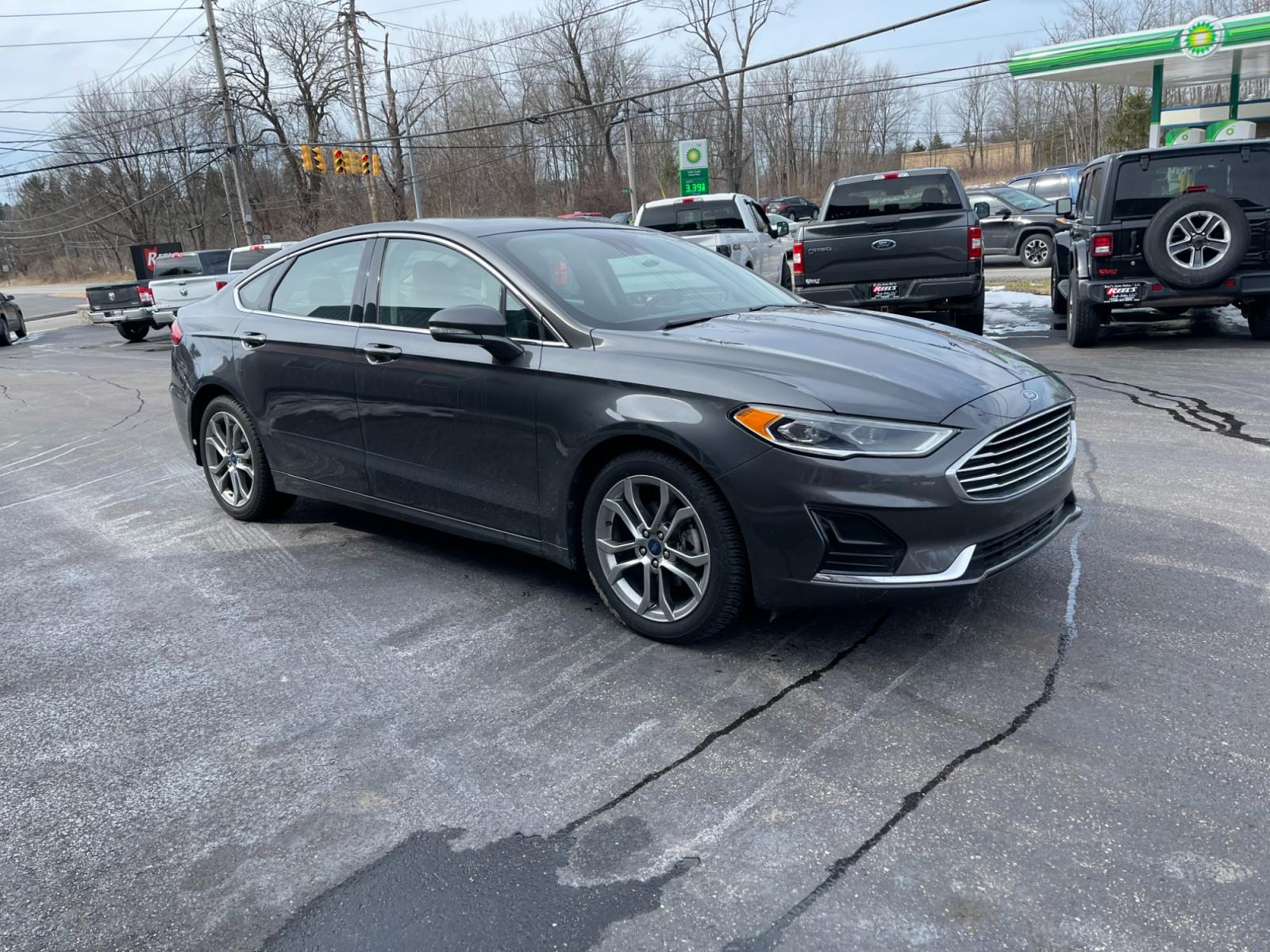 2019 Gray /Black Ford Fusion SEL (3FA6P0CD5KR) with an 1.5L I4 DOHC 16V TURBO engine, 6A transmission, located at 11115 Chardon Rd. , Chardon, OH, 44024, (440) 214-9705, 41.580246, -81.241943 - Photo #3
