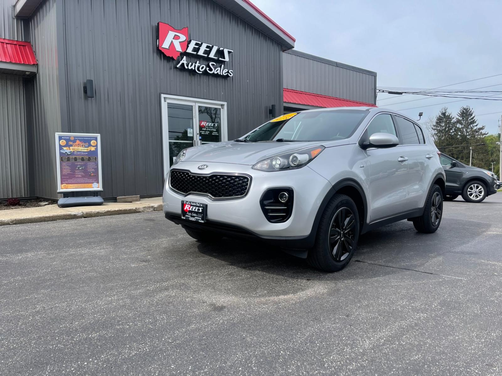2018 Silver /Black Kia Sportage LX AWD (KNDPMCAC8J7) with an 2.4L I4 DOHC 24V engine, 6A transmission, located at 547 E. Main St., Orwell, OH, 44076, (440) 437-5893, 41.535435, -80.847855 - 2018 Kia Sportage LX AWD ---- Only 64K Miles ---- Heated Seats ---- 23 MPG Combined ---- Fully Serviced and Recently Detailed ---- Reel's Auto Sales is located in both Chardon and Orwell Ohio. Financing available and trades welcome. Please call or text to confirm location, set an appointment or disc - Photo #0