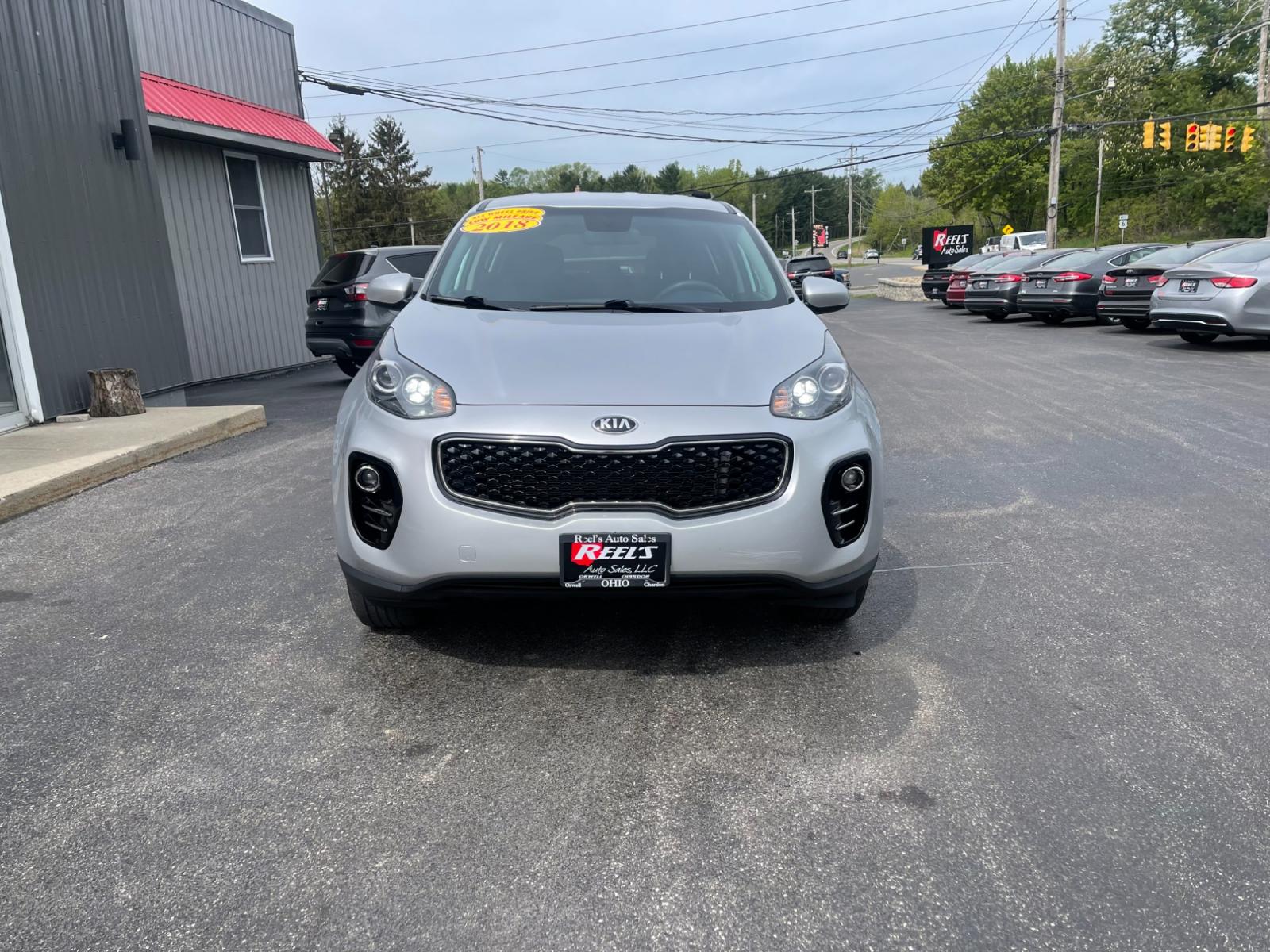 2018 Silver /Black Kia Sportage LX AWD (KNDPMCAC8J7) with an 2.4L I4 DOHC 24V engine, 6A transmission, located at 547 E. Main St., Orwell, OH, 44076, (440) 437-5893, 41.535435, -80.847855 - 2018 Kia Sportage LX AWD ---- Only 64K Miles ---- Heated Seats ---- 23 MPG Combined ---- Fully Serviced and Recently Detailed ---- Reel's Auto Sales is located in both Chardon and Orwell Ohio. Financing available and trades welcome. Please call or text to confirm location, set an appointment or disc - Photo #1