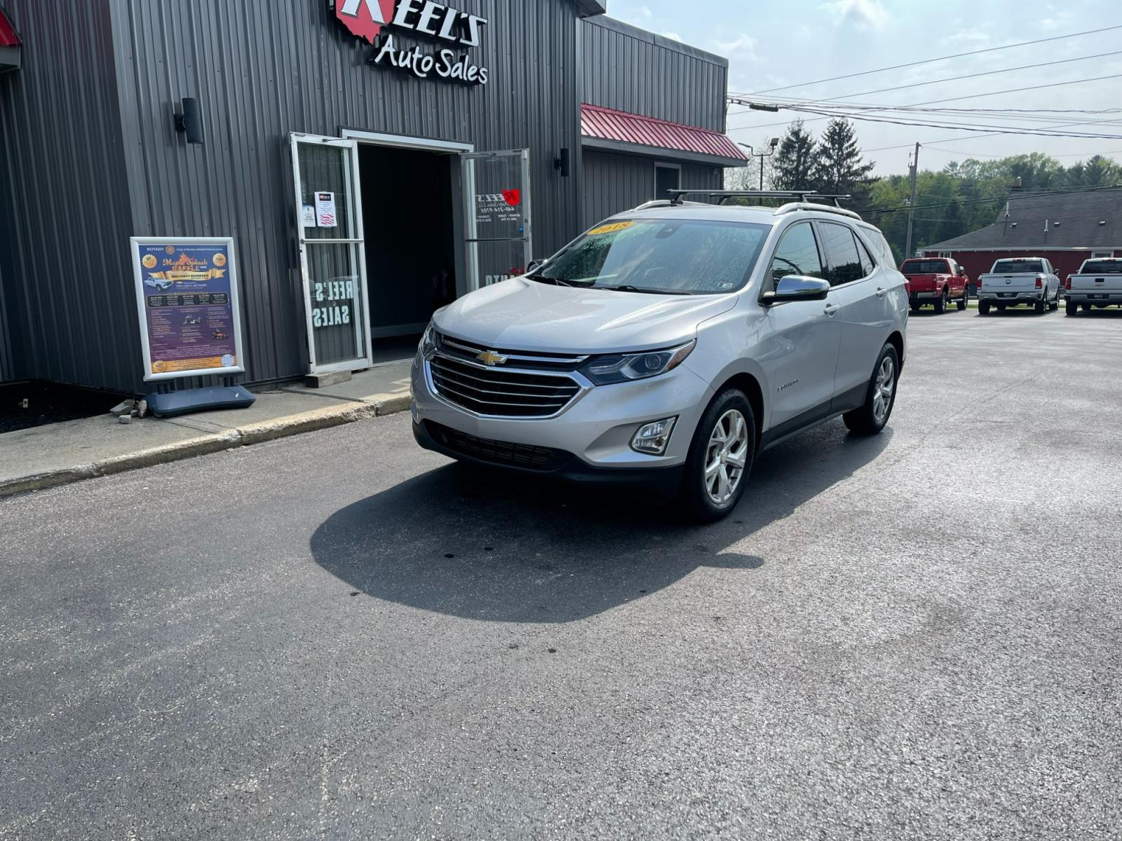2018 Silver /Black Chevrolet Equinox Premier AWD (2GNAXVEV1J6) with an 1.5L I4 DIR DOHC 16V TURBO engine, 6A transmission, located at 547 E. Main St., Orwell, OH, 44076, (440) 437-5893, 41.535435, -80.847855 - 2018 Chevrolet Equinox Premier AWD ---- Heated And Cooled Seats ---- Heated Rear Seats ---- All Wheel Drive ---- 26 MPG Combined ---- Fully Serviced and Recently Detailed ---- Reel's Auto Sales is located in both Chardon and Orwell Ohio. Financing available and trades welcome. Please call or text to - Photo #0