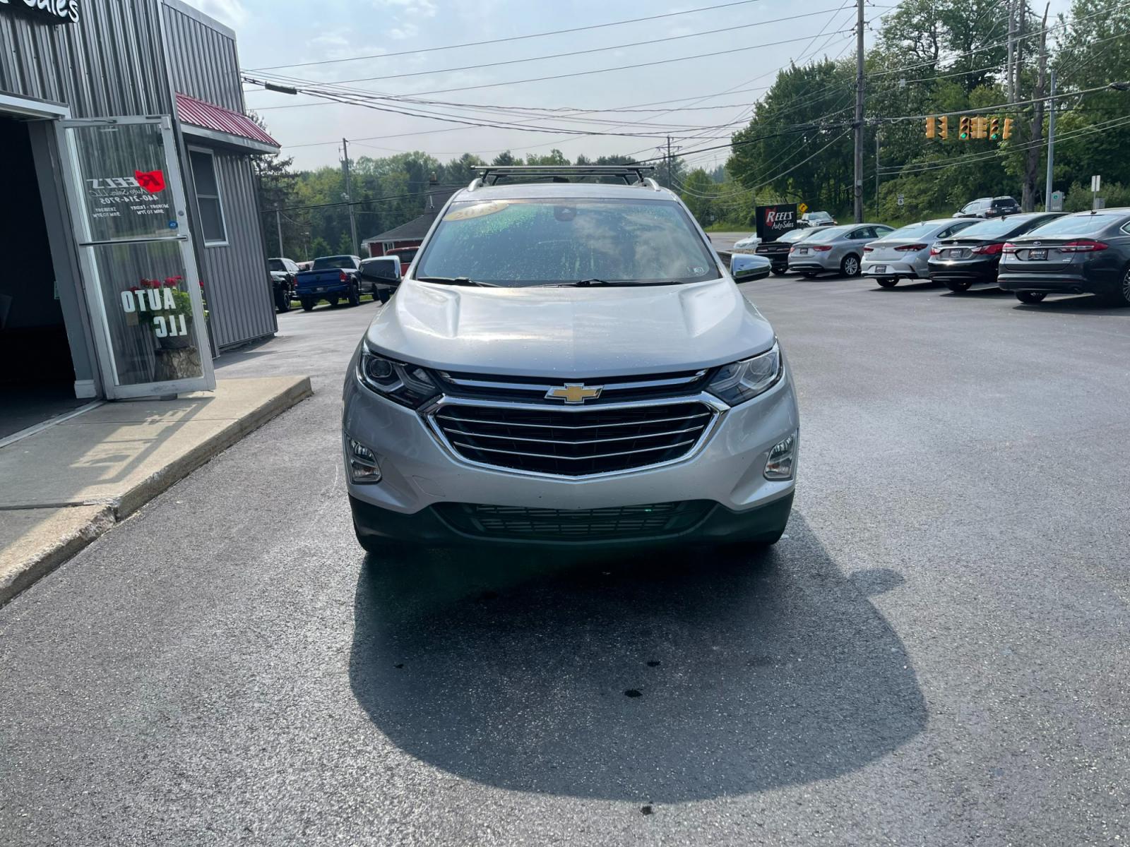 2018 Silver /Black Chevrolet Equinox Premier AWD (2GNAXVEV1J6) with an 1.5L I4 DIR DOHC 16V TURBO engine, 6A transmission, located at 547 E. Main St., Orwell, OH, 44076, (440) 437-5893, 41.535435, -80.847855 - 2018 Chevrolet Equinox Premier AWD ---- Heated And Cooled Seats ---- Heated Rear Seats ---- All Wheel Drive ---- 26 MPG Combined ---- Fully Serviced and Recently Detailed ---- Reel's Auto Sales is located in both Chardon and Orwell Ohio. Financing available and trades welcome. Please call or text to - Photo #1