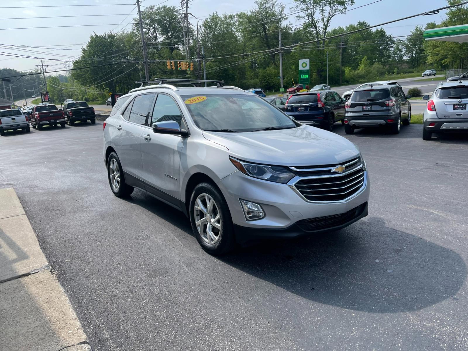 2018 Silver /Black Chevrolet Equinox Premier AWD (2GNAXVEV1J6) with an 1.5L I4 DIR DOHC 16V TURBO engine, 6A transmission, located at 547 E. Main St., Orwell, OH, 44076, (440) 437-5893, 41.535435, -80.847855 - 2018 Chevrolet Equinox Premier AWD ---- Heated And Cooled Seats ---- Heated Rear Seats ---- All Wheel Drive ---- 26 MPG Combined ---- Fully Serviced and Recently Detailed ---- Reel's Auto Sales is located in both Chardon and Orwell Ohio. Financing available and trades welcome. Please call or text to - Photo #2