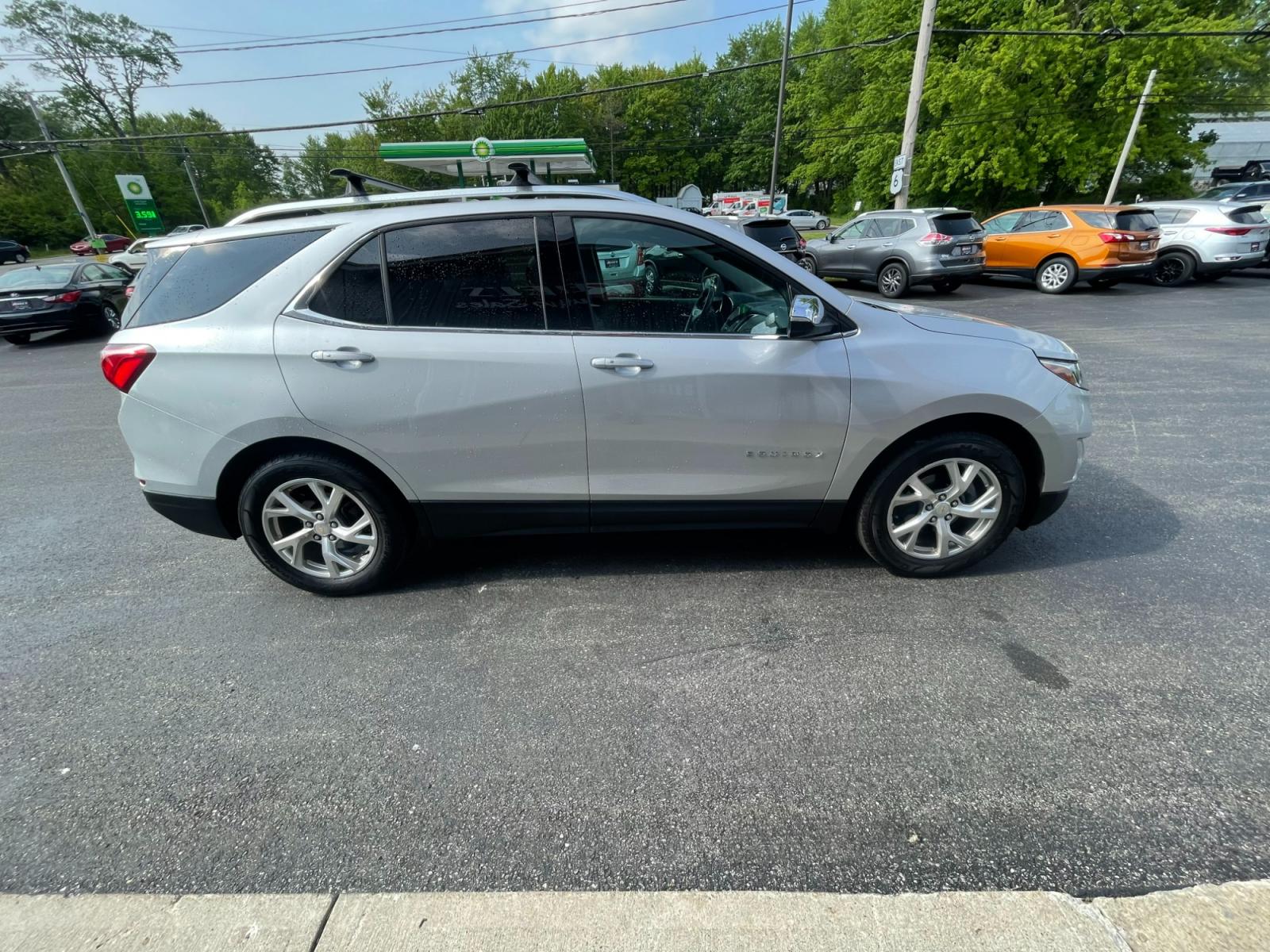 2018 Silver /Black Chevrolet Equinox Premier AWD (2GNAXVEV1J6) with an 1.5L I4 DIR DOHC 16V TURBO engine, 6A transmission, located at 547 E. Main St., Orwell, OH, 44076, (440) 437-5893, 41.535435, -80.847855 - 2018 Chevrolet Equinox Premier AWD ---- Heated And Cooled Seats ---- Heated Rear Seats ---- All Wheel Drive ---- 26 MPG Combined ---- Fully Serviced and Recently Detailed ---- Reel's Auto Sales is located in both Chardon and Orwell Ohio. Financing available and trades welcome. Please call or text to - Photo #5
