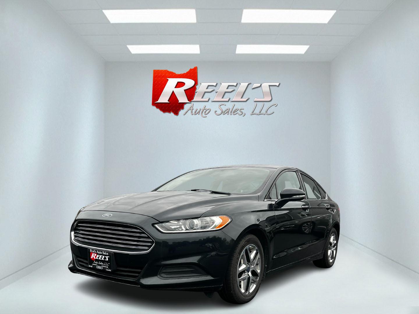2014 Black /Black Ford Fusion SE (3FA6P0H70ER) with an 2.5L I4 DOHC 16V engine, 6 Speed Automatic transmission, located at 11115 Chardon Rd. , Chardon, OH, 44024, (440) 214-9705, 41.580246, -81.241943 - This 2014 Ford Fusion SE with a 2.5-liter Duratec I4 engine and 6-speed automatic transmission offers a blend of efficiency and comfort, suitable for both urban and highway driving. It features practical amenities like daytime running lights, dusk sensing headlights for improved visibility and safet - Photo#0