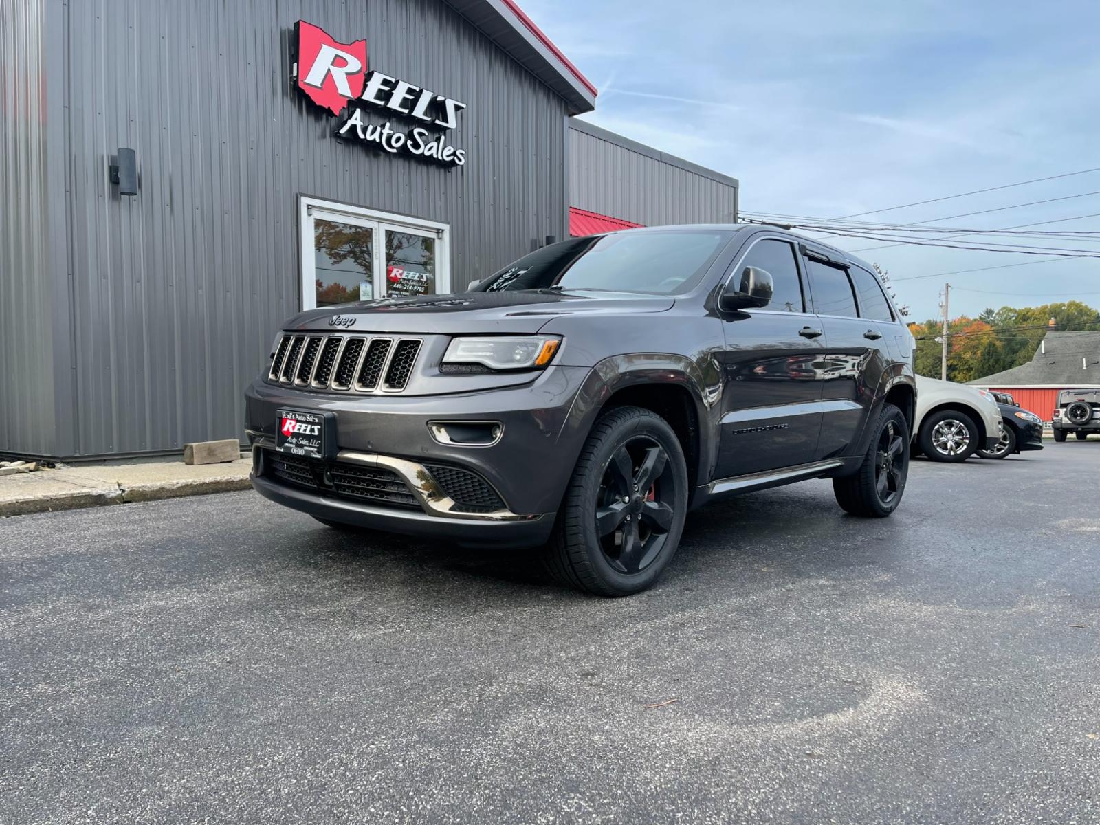 2015 Gray /Black Jeep Grand Cherokee High Altitude 4WD (1C4RJFCTXFC) with an 5.7L V8 OHV 16V engine, 8-Speed Automatic transmission, located at 11115 Chardon Rd. , Chardon, OH, 44024, (440) 214-9705, 41.580246, -81.241943 - This 2015 Jeep Grand Cherokee High Altitude 4WD comes equipped with a powerful 5.7 V8 engine and a 19 speaker Harmon Kardon sound system, making it a top-of-the-line SUV. This model also features 4-wheel drive for enhanced traction and off-road capabilities. With its spacious interior, luxury amenit - Photo #0