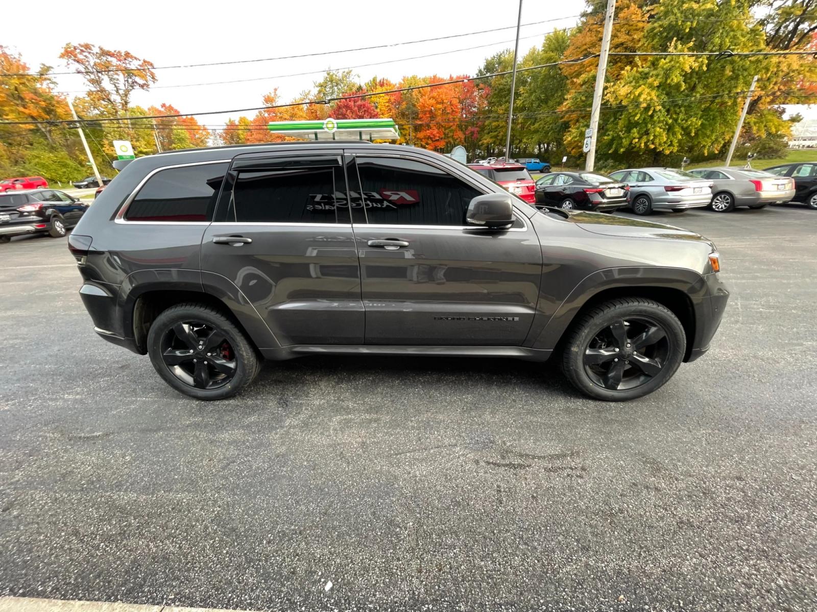 2015 Gray /Black Jeep Grand Cherokee High Altitude 4WD (1C4RJFCTXFC) with an 5.7L V8 OHV 16V engine, 8-Speed Automatic transmission, located at 11115 Chardon Rd. , Chardon, OH, 44024, (440) 214-9705, 41.580246, -81.241943 - This 2015 Jeep Grand Cherokee High Altitude 4WD comes equipped with a powerful 5.7 V8 engine and a 19 speaker Harmon Kardon sound system, making it a top-of-the-line SUV. This model also features 4-wheel drive for enhanced traction and off-road capabilities. With its spacious interior, luxury amenit - Photo #6