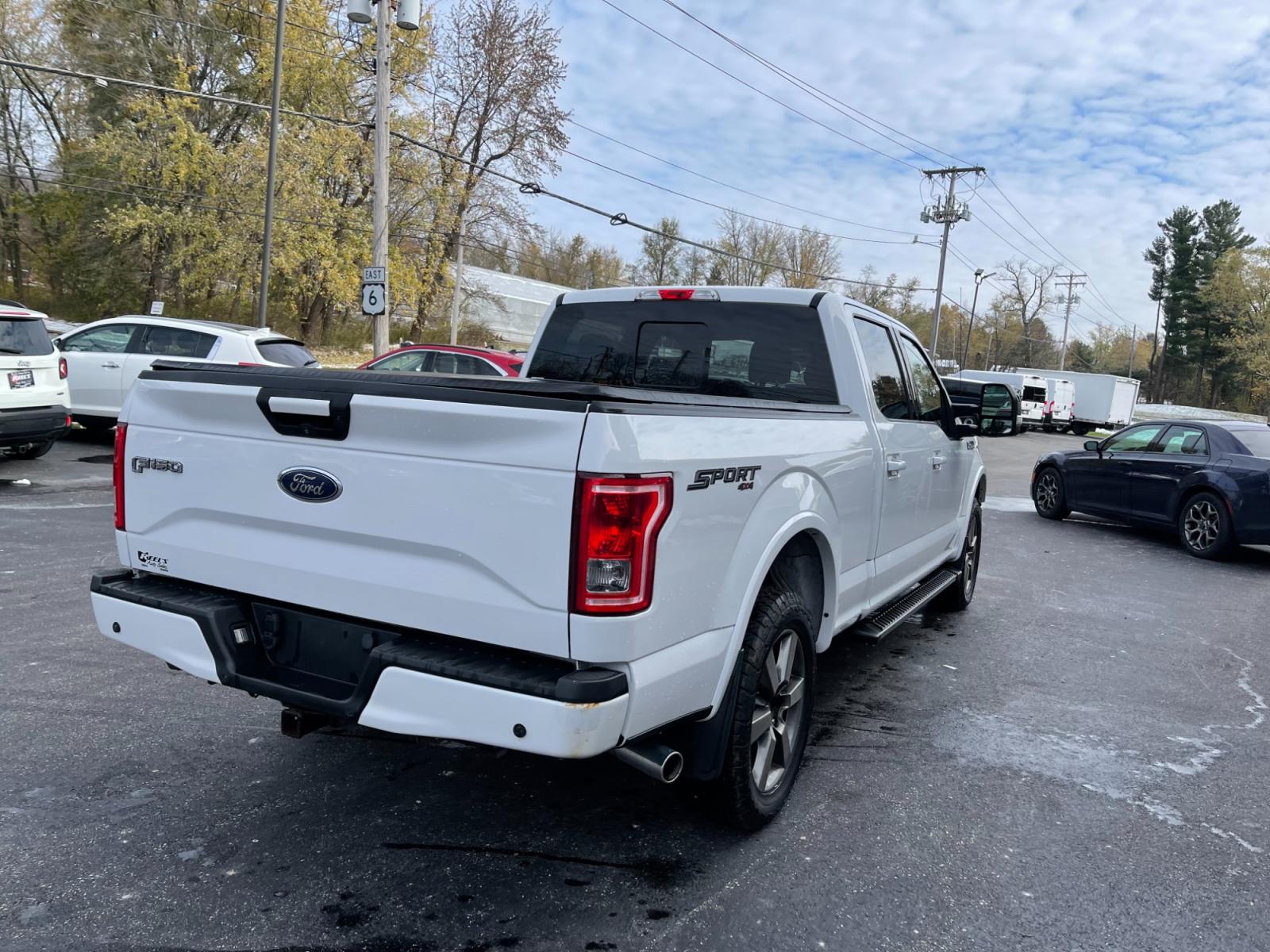 2017 White /Black Ford F-150 XLT SuperCrew 6.5-ft. Bed 4WD (1FTFW1EF2HF) with an 5.0L V8 engine, 6A transmission, located at 11115 Chardon Rd. , Chardon, OH, 44024, (440) 214-9705, 41.580246, -81.241943 - This 2017 Ford F-150 XLT Crew Cab is a powerful and spacious vehicle with a 5.0-liter V8 engine that produces 385 horsepower. The Sport Package gives the truck an athletic appearance with its 20-inch wheels, black grille, and body-colored bumpers. The 302A Package adds features such as power-adjusta - Photo #9
