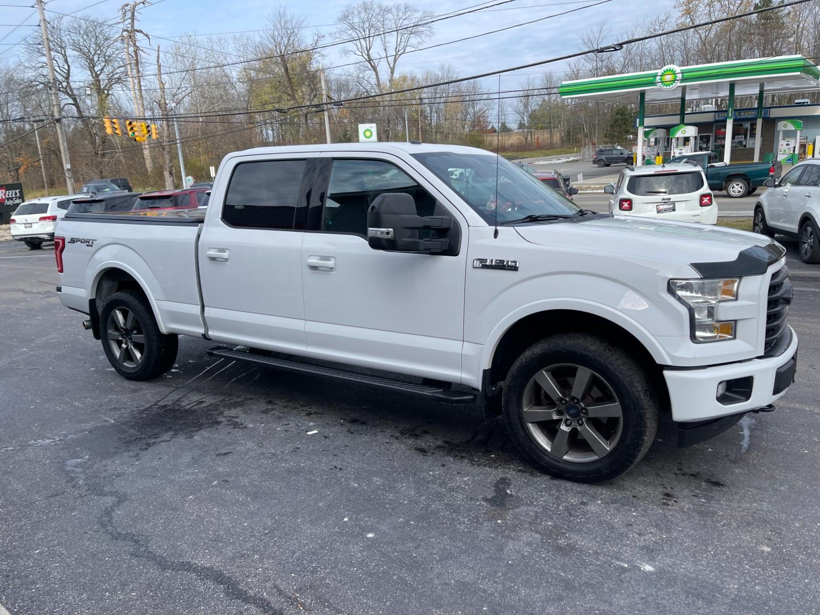 2017 White /Black Ford F-150 XLT SuperCrew 6.5-ft. Bed 4WD (1FTFW1EF2HF) with an 5.0L V8 engine, 6A transmission, located at 11115 Chardon Rd. , Chardon, OH, 44024, (440) 214-9705, 41.580246, -81.241943 - This 2017 Ford F-150 XLT Crew Cab is a powerful and spacious vehicle with a 5.0-liter V8 engine that produces 385 horsepower. The Sport Package gives the truck an athletic appearance with its 20-inch wheels, black grille, and body-colored bumpers. The 302A Package adds features such as power-adjusta - Photo #3