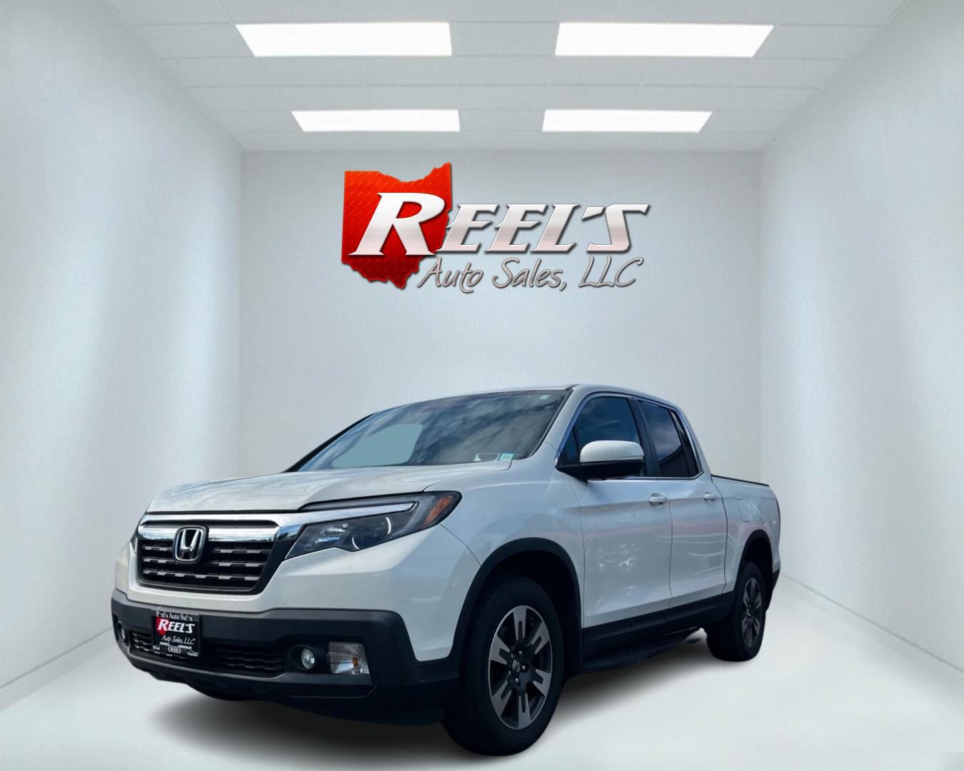 2017 White /Tan Honda Ridgeline RTL-T AWD (5FPYK3F61HB) with an 3.5L V6 SOHC 24V engine, 6-Speed Automatic transmission, located at 11115 Chardon Rd. , Chardon, OH, 44024, (440) 214-9705, 41.580246, -81.241943 - Photo#0