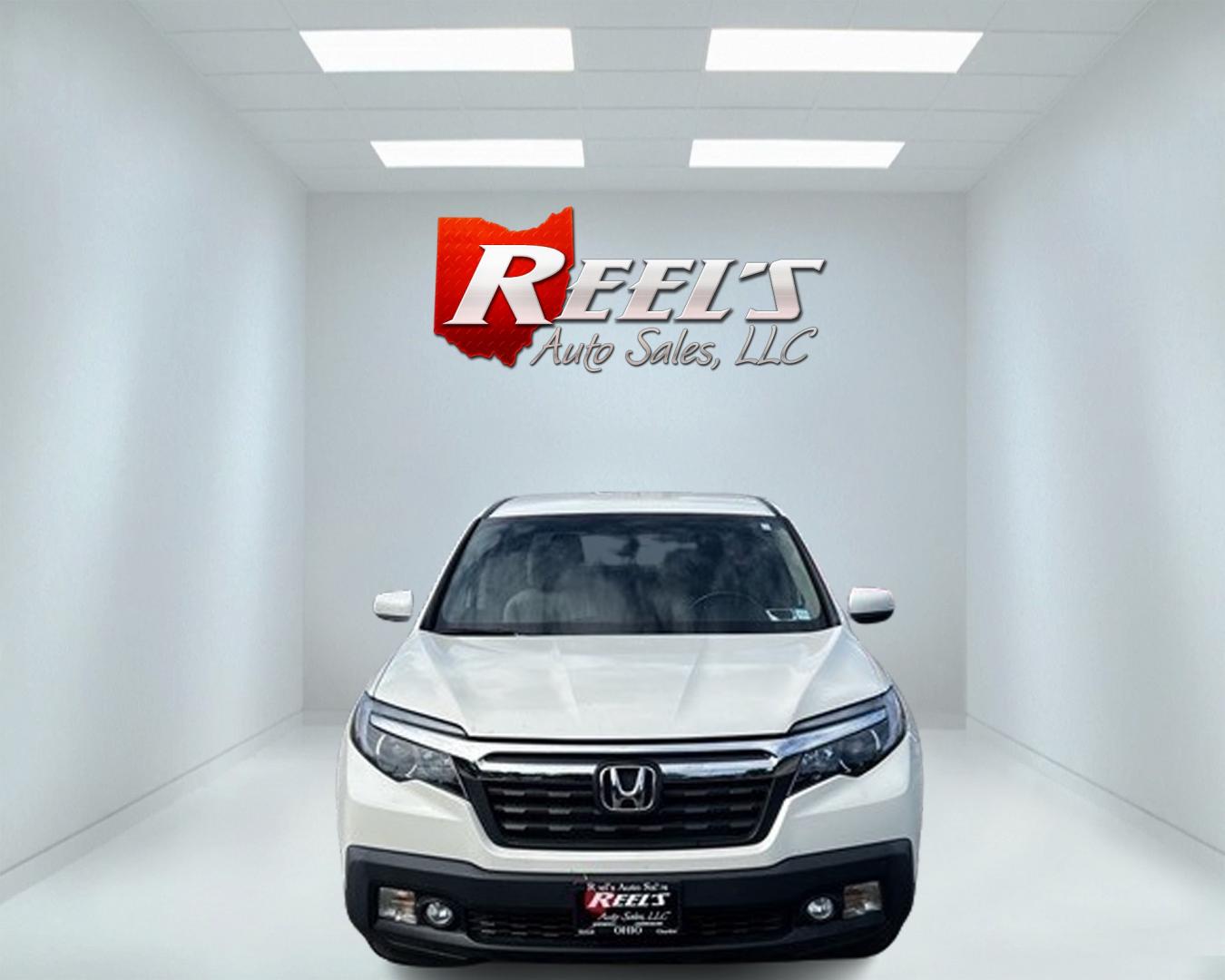 2017 White /Tan Honda Ridgeline RTL-T AWD (5FPYK3F61HB) with an 3.5L V6 SOHC 24V engine, 6-Speed Automatic transmission, located at 11115 Chardon Rd. , Chardon, OH, 44024, (440) 214-9705, 41.580246, -81.241943 - Photo#1