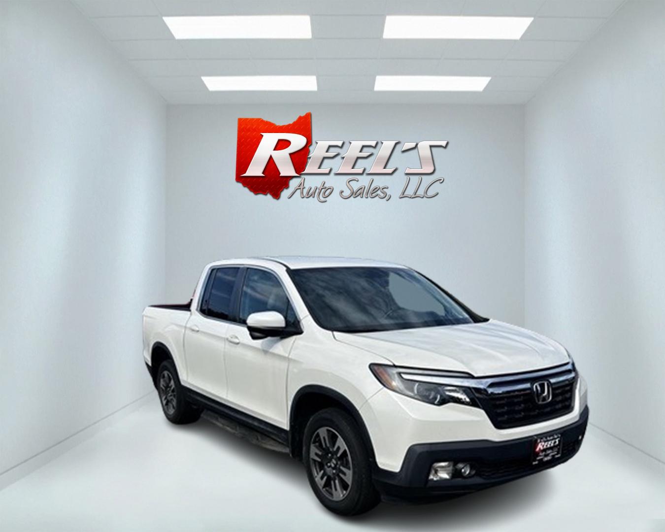 2017 White /Tan Honda Ridgeline RTL-T AWD (5FPYK3F61HB) with an 3.5L V6 SOHC 24V engine, 6-Speed Automatic transmission, located at 11115 Chardon Rd. , Chardon, OH, 44024, (440) 214-9705, 41.580246, -81.241943 - Photo#2