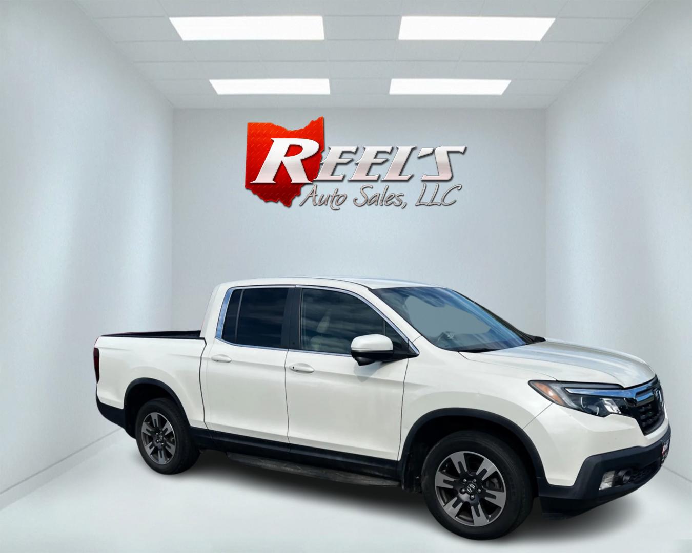 2017 White /Tan Honda Ridgeline RTL-T AWD (5FPYK3F61HB) with an 3.5L V6 SOHC 24V engine, 6-Speed Automatic transmission, located at 11115 Chardon Rd. , Chardon, OH, 44024, (440) 214-9705, 41.580246, -81.241943 - Photo#3