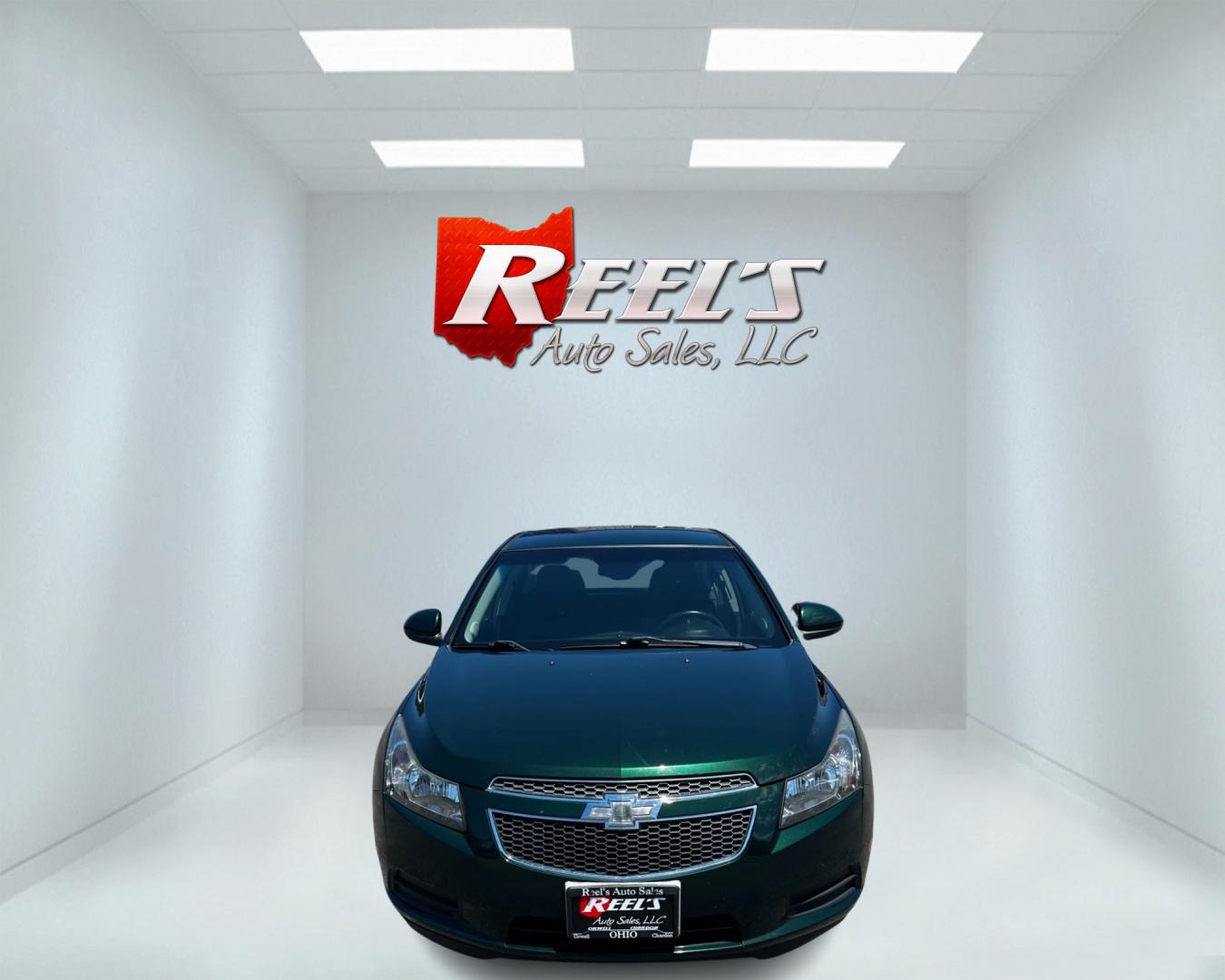 2014 Green /Black Chevrolet Cruze 1LT Auto (1G1PC5SB2E7) with an 1.4L I4 DOHC 16V TURBO engine, 6-Speed Automatic transmission, located at 11115 Chardon Rd. , Chardon, OH, 44024, (440) 214-9705, 41.580246, -81.241943 - Photo#1