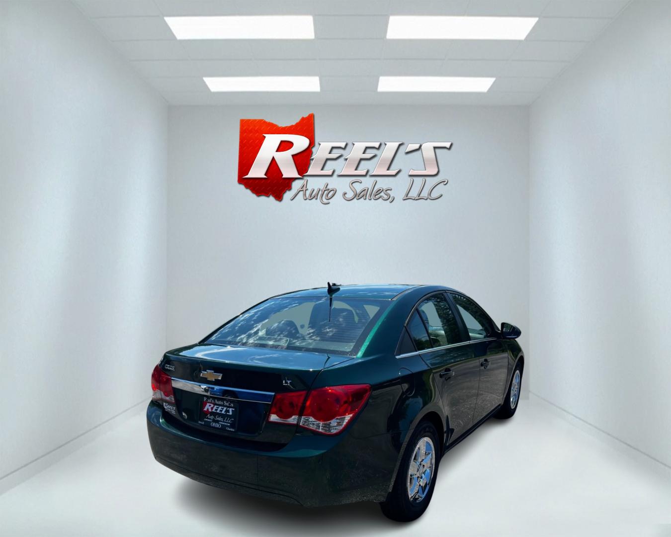 2014 Green /Black Chevrolet Cruze 1LT Auto (1G1PC5SB2E7) with an 1.4L I4 DOHC 16V TURBO engine, 6-Speed Automatic transmission, located at 11115 Chardon Rd. , Chardon, OH, 44024, (440) 214-9705, 41.580246, -81.241943 - Photo#5