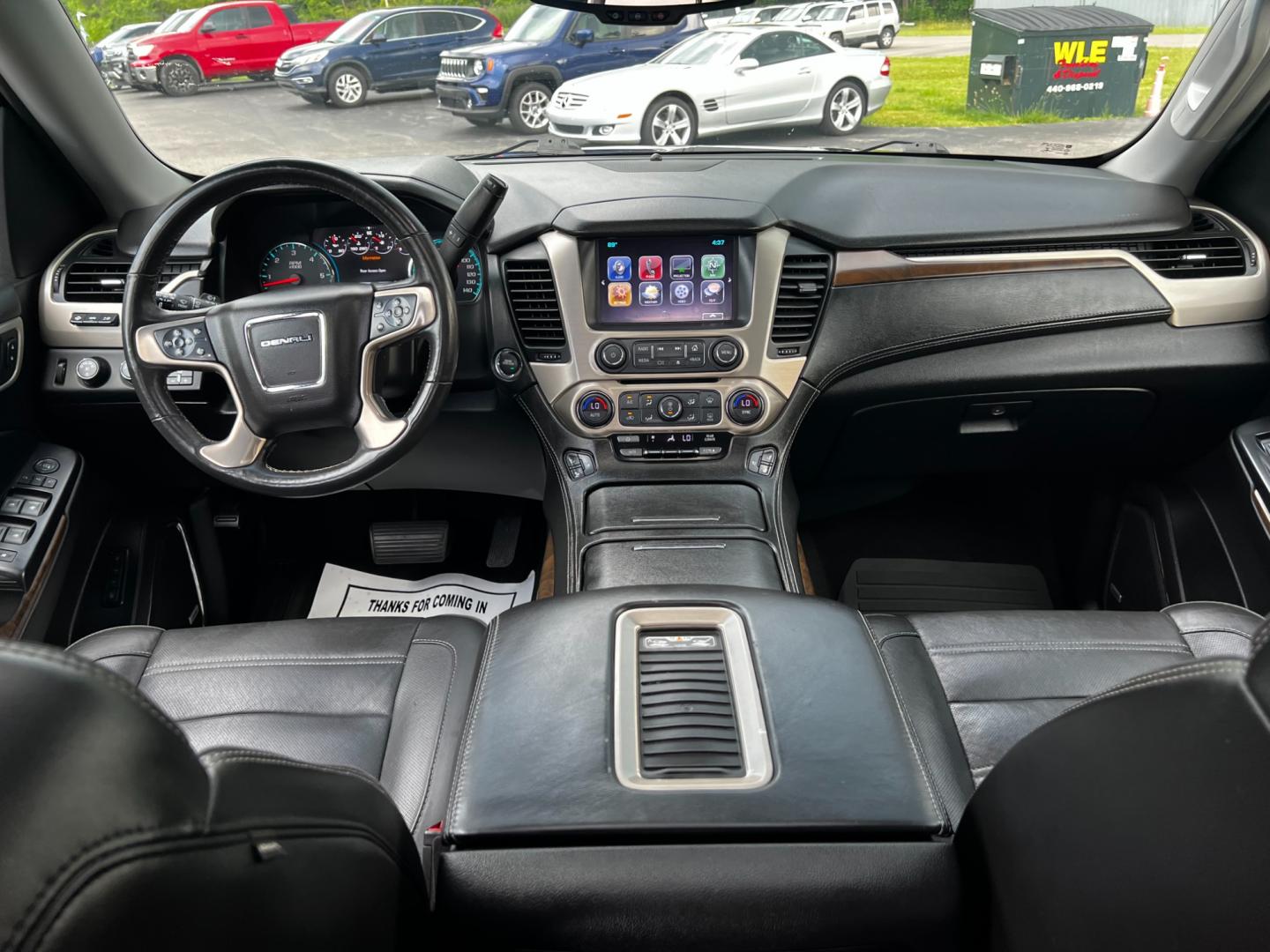 2018 Black /Black GMC Yukon XL Denali 4WD (1GKS2HKJ0JR) with an 6.2L V8 OHV 16V engine, 10 Speed Auto transmission, located at 547 E. Main St., Orwell, OH, 44076, (440) 437-5893, 41.535435, -80.847855 - This 2018 GMC Yukon XL Denali 4WD, powered by a robust 6.2 V8 engine with a 10-speed automatic transmission delivering 420 HP, is a powerful and luxurious full-size SUV. With a 7,900-pound towing capacity, it is well-suited for heavy-duty tasks. The HID headlights, LED daytime running lights, and ra - Photo#42