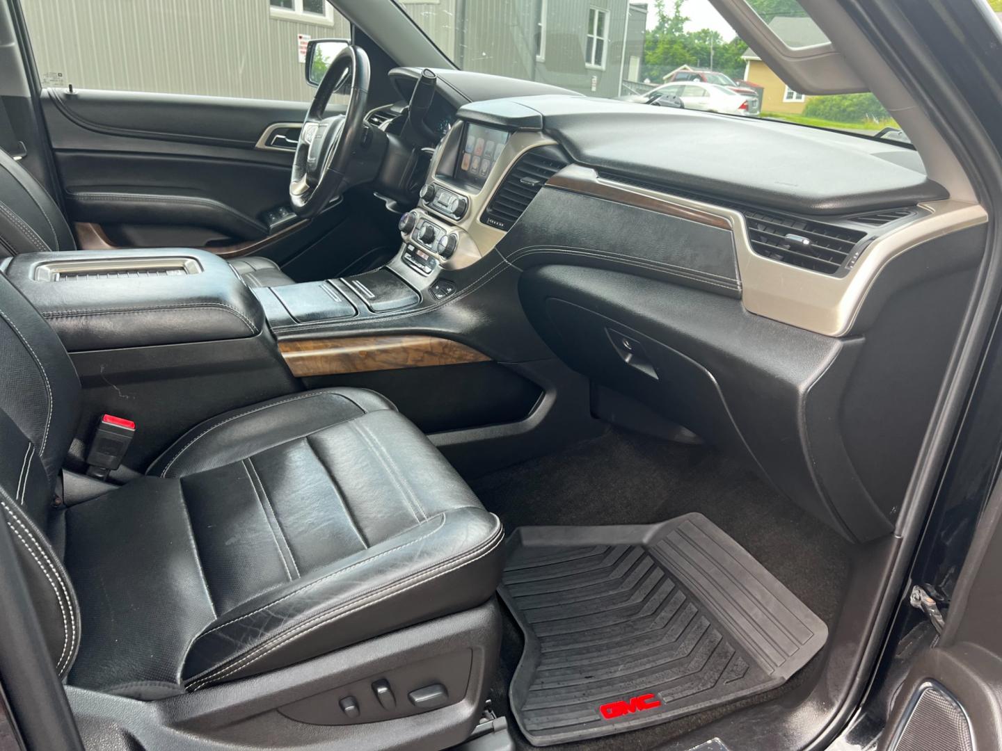2018 Black /Black GMC Yukon XL Denali 4WD (1GKS2HKJ0JR) with an 6.2L V8 OHV 16V engine, 10 Speed Auto transmission, located at 547 E. Main St., Orwell, OH, 44076, (440) 437-5893, 41.535435, -80.847855 - This 2018 GMC Yukon XL Denali 4WD, powered by a robust 6.2 V8 engine with a 10-speed automatic transmission delivering 420 HP, is a powerful and luxurious full-size SUV. With a 7,900-pound towing capacity, it is well-suited for heavy-duty tasks. The HID headlights, LED daytime running lights, and ra - Photo#49