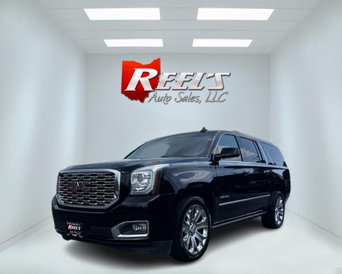 2018 Black /Black GMC Yukon XL Denali 4WD (1GKS2HKJ0JR) with an 6.2L V8 OHV 16V engine, 10 Speed Auto transmission, located at 547 E. Main St., Orwell, OH, 44076, (440) 437-5893, 41.535435, -80.847855 - This 2018 GMC Yukon XL Denali 4WD, powered by a robust 6.2 V8 engine with a 10-speed automatic transmission delivering 420 HP, is a powerful and luxurious full-size SUV. With a 7,900-pound towing capacity, it is well-suited for heavy-duty tasks. The HID headlights, LED daytime running lights, and ra - Photo#0