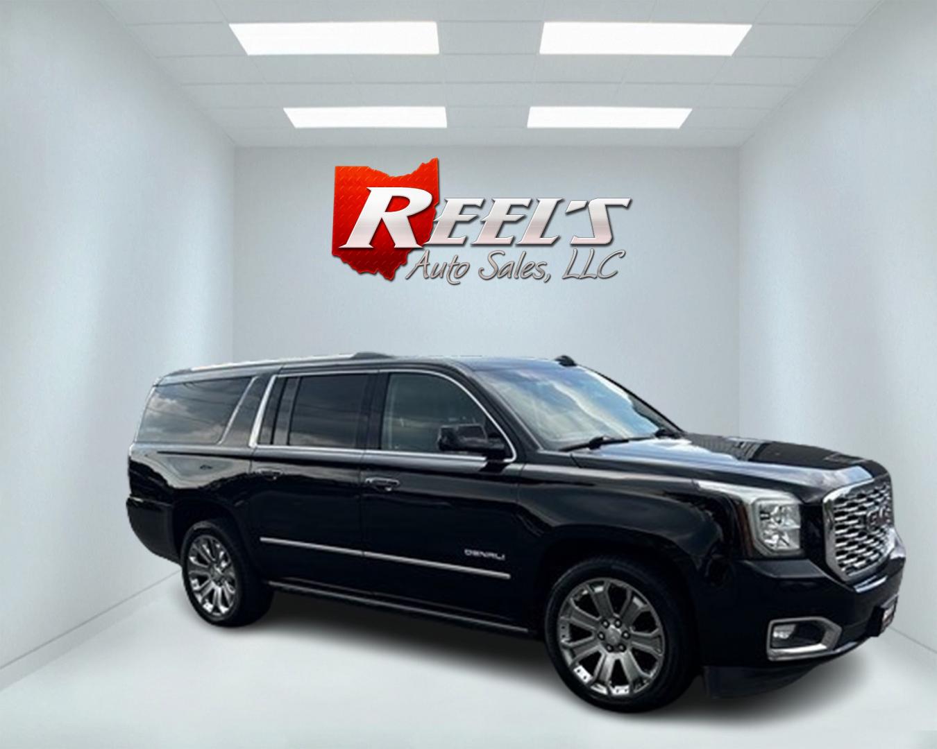 2018 Black /Black GMC Yukon XL Denali 4WD (1GKS2HKJ0JR) with an 6.2L V8 OHV 16V engine, 10 Speed Auto transmission, located at 547 E. Main St., Orwell, OH, 44076, (440) 437-5893, 41.535435, -80.847855 - This 2018 GMC Yukon XL Denali 4WD, powered by a robust 6.2 V8 engine with a 10-speed automatic transmission delivering 420 HP, is a powerful and luxurious full-size SUV. With a 7,900-pound towing capacity, it is well-suited for heavy-duty tasks. The HID headlights, LED daytime running lights, and ra - Photo#2