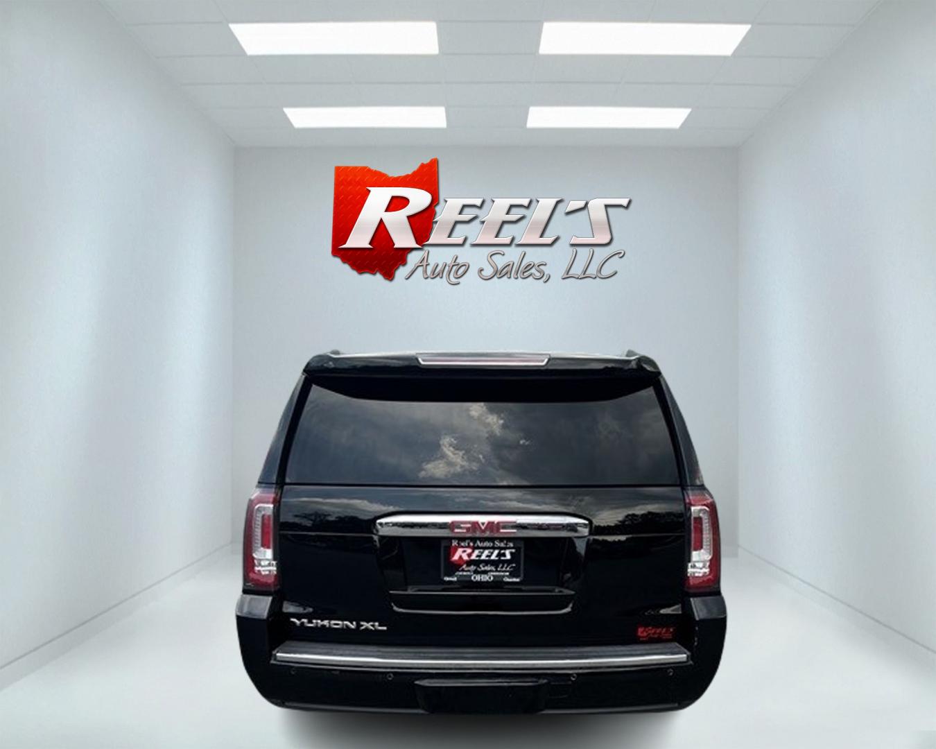 2018 Black /Black GMC Yukon XL Denali 4WD (1GKS2HKJ0JR) with an 6.2L V8 OHV 16V engine, 10 Speed Auto transmission, located at 547 E. Main St., Orwell, OH, 44076, (440) 437-5893, 41.535435, -80.847855 - This 2018 GMC Yukon XL Denali 4WD, powered by a robust 6.2 V8 engine with a 10-speed automatic transmission delivering 420 HP, is a powerful and luxurious full-size SUV. With a 7,900-pound towing capacity, it is well-suited for heavy-duty tasks. The HID headlights, LED daytime running lights, and ra - Photo#5