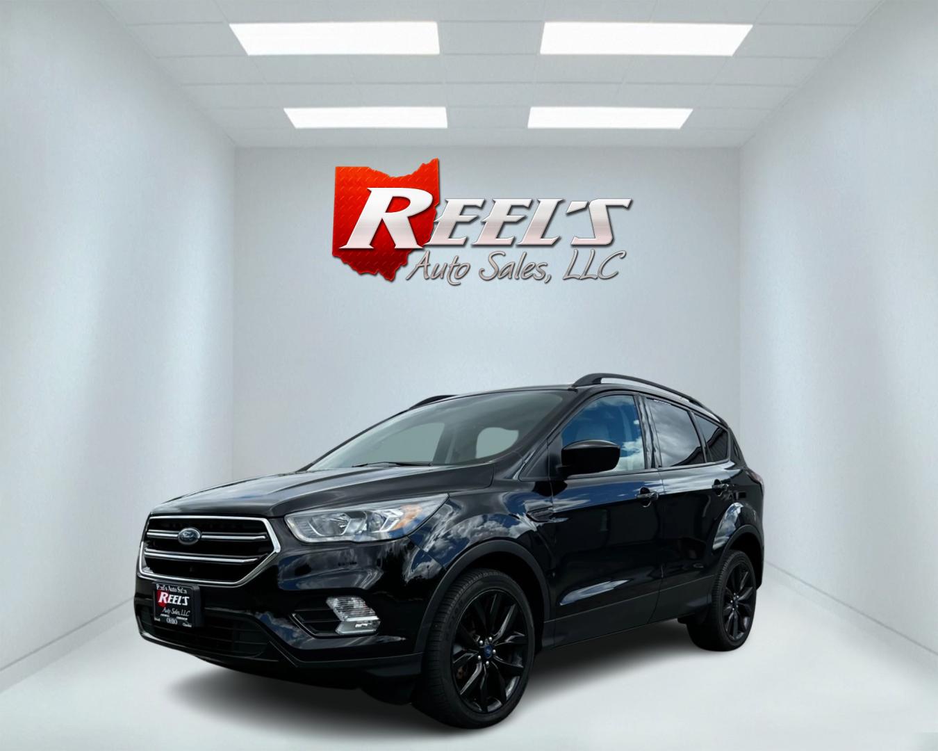 2018 Black /White Ford Escape SEL 4WD (1FMCU9HD1JU) with an 1.5L I4 DOHC 16V TURBO engine, 6A transmission, located at 547 E. Main St., Orwell, OH, 44076, (440) 437-5893, 41.535435, -80.847855 - Photo#0