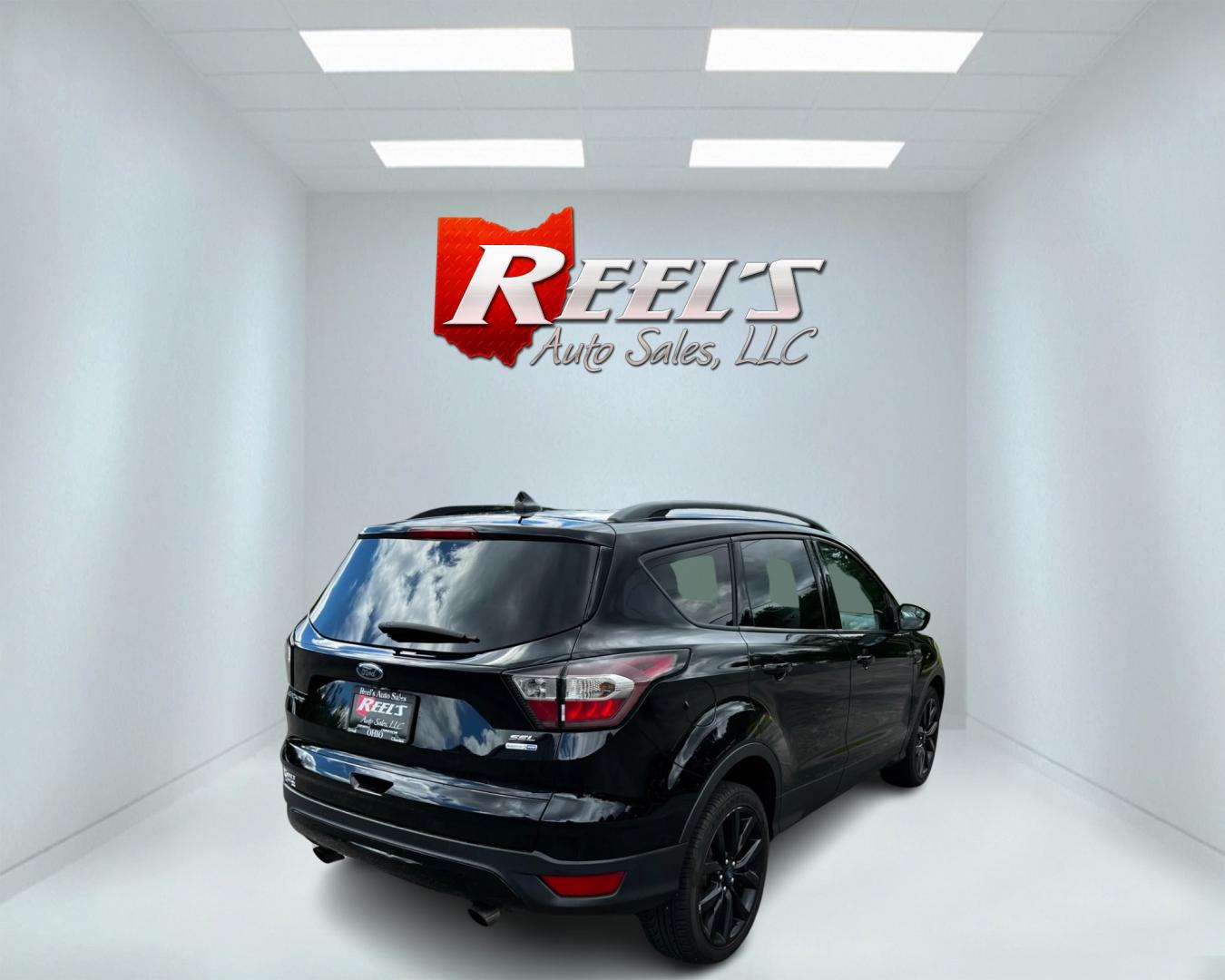 2018 Black /White Ford Escape SEL 4WD (1FMCU9HD1JU) with an 1.5L I4 DOHC 16V TURBO engine, 6A transmission, located at 547 E. Main St., Orwell, OH, 44076, (440) 437-5893, 41.535435, -80.847855 - Photo#4