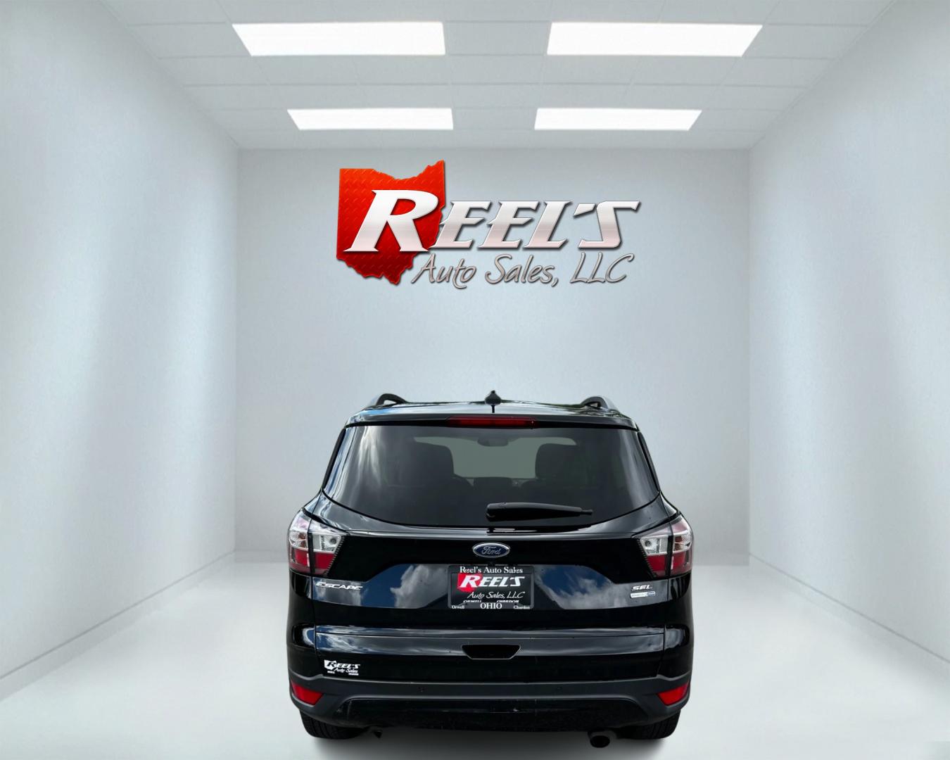 2018 Black /White Ford Escape SEL 4WD (1FMCU9HD1JU) with an 1.5L I4 DOHC 16V TURBO engine, 6A transmission, located at 547 E. Main St., Orwell, OH, 44076, (440) 437-5893, 41.535435, -80.847855 - Photo#5