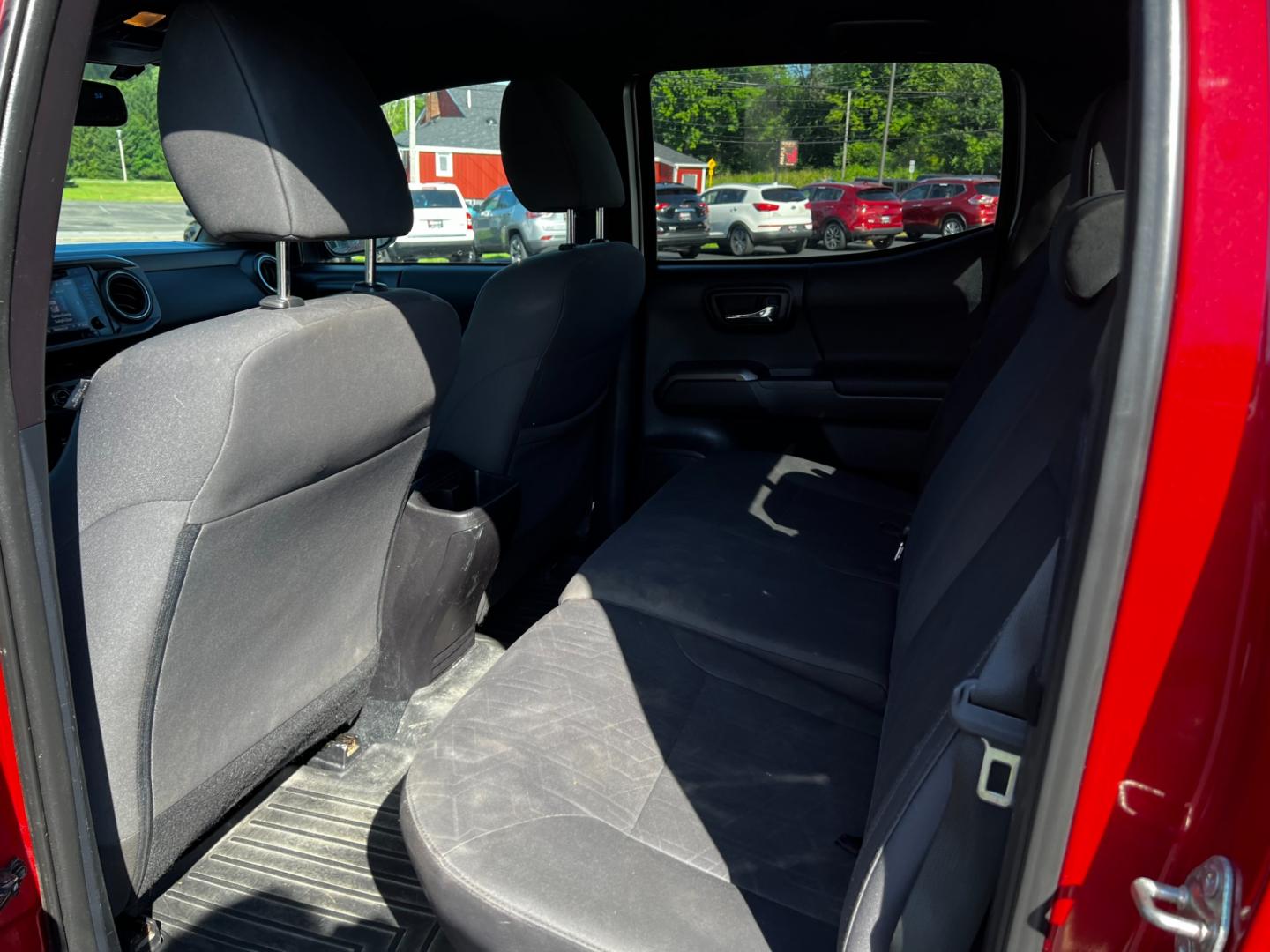 2016 Red /Black Toyota Tacoma TRD Sport Double Cab Short Bed V6 6M 4WD (5TFCZ5AN3GX) with an 3.6L V6 DOHC 24V engine, 6 Speed Manual transmission, located at 11115 Chardon Rd. , Chardon, OH, 44024, (440) 214-9705, 41.580246, -81.241943 - This 2016 Toyota Tacoma TRD Sport Double Cab is a well-equipped mid-size pickup truck that offers a blend of performance, technology, and utility. It features a powerful 3.5-liter Atkinson cycle V6 engine paired with a 6-speed manual transmission, providing a balance of power and efficiency with a h - Photo#35