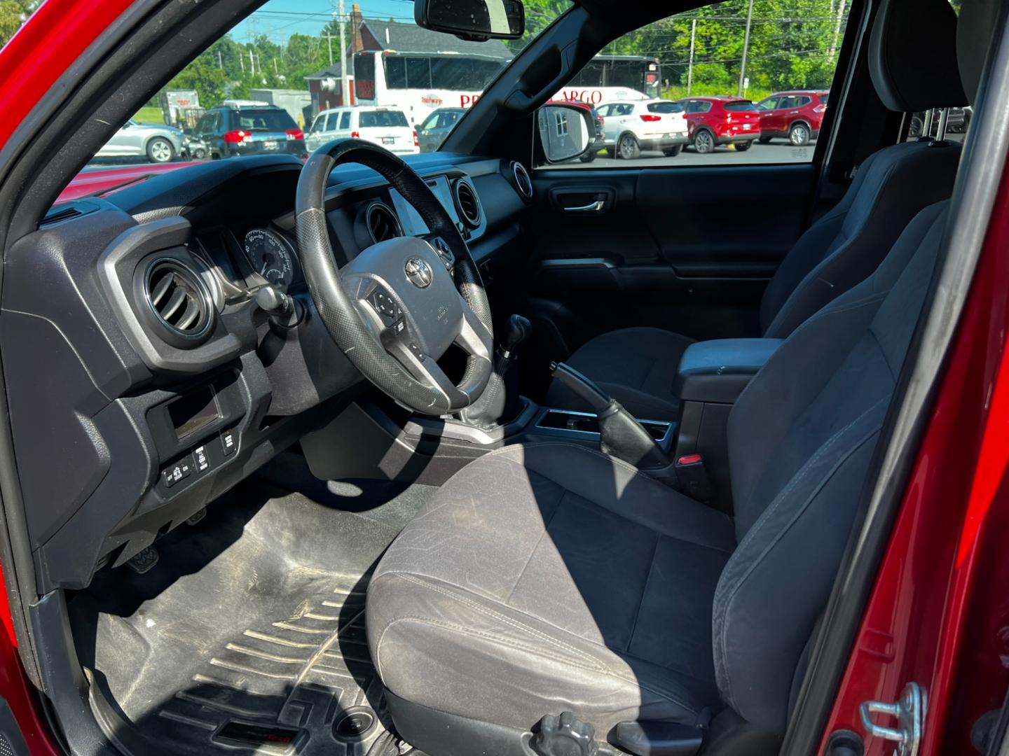 2016 Red /Black Toyota Tacoma TRD Sport Double Cab Short Bed V6 6M 4WD (5TFCZ5AN3GX) with an 3.6L V6 DOHC 24V engine, 6 Speed Manual transmission, located at 11115 Chardon Rd. , Chardon, OH, 44024, (440) 214-9705, 41.580246, -81.241943 - This 2016 Toyota Tacoma TRD Sport Double Cab is a well-equipped mid-size pickup truck that offers a blend of performance, technology, and utility. It features a powerful 3.5-liter Atkinson cycle V6 engine paired with a 6-speed manual transmission, providing a balance of power and efficiency with a h - Photo#21