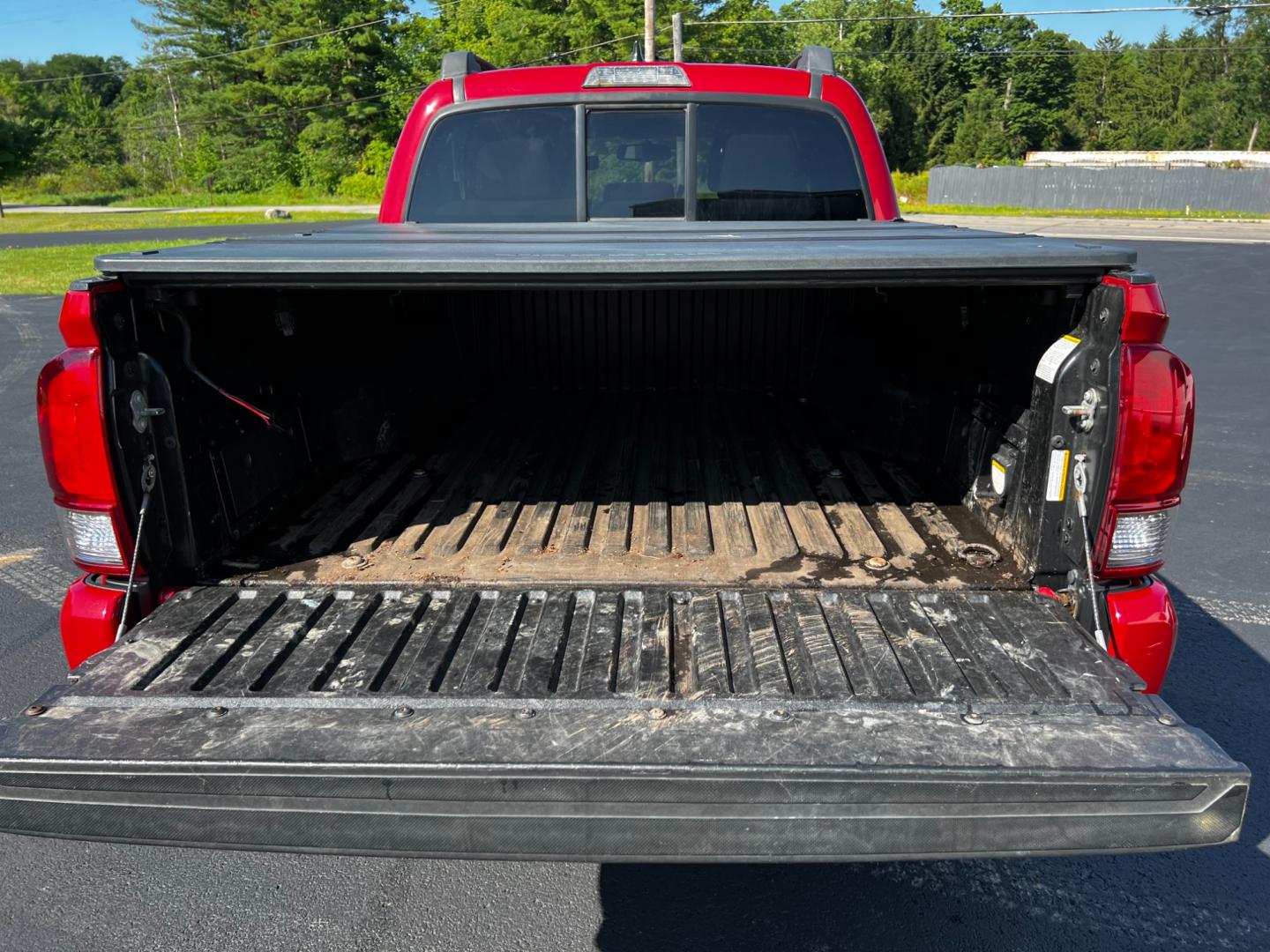 2016 Red /Black Toyota Tacoma TRD Sport Double Cab Short Bed V6 6M 4WD (5TFCZ5AN3GX) with an 3.6L V6 DOHC 24V engine, 6 Speed Manual transmission, located at 11115 Chardon Rd. , Chardon, OH, 44024, (440) 214-9705, 41.580246, -81.241943 - This 2016 Toyota Tacoma TRD Sport Double Cab is a well-equipped mid-size pickup truck that offers a blend of performance, technology, and utility. It features a powerful 3.5-liter Atkinson cycle V6 engine paired with a 6-speed manual transmission, providing a balance of power and efficiency with a h - Photo#14