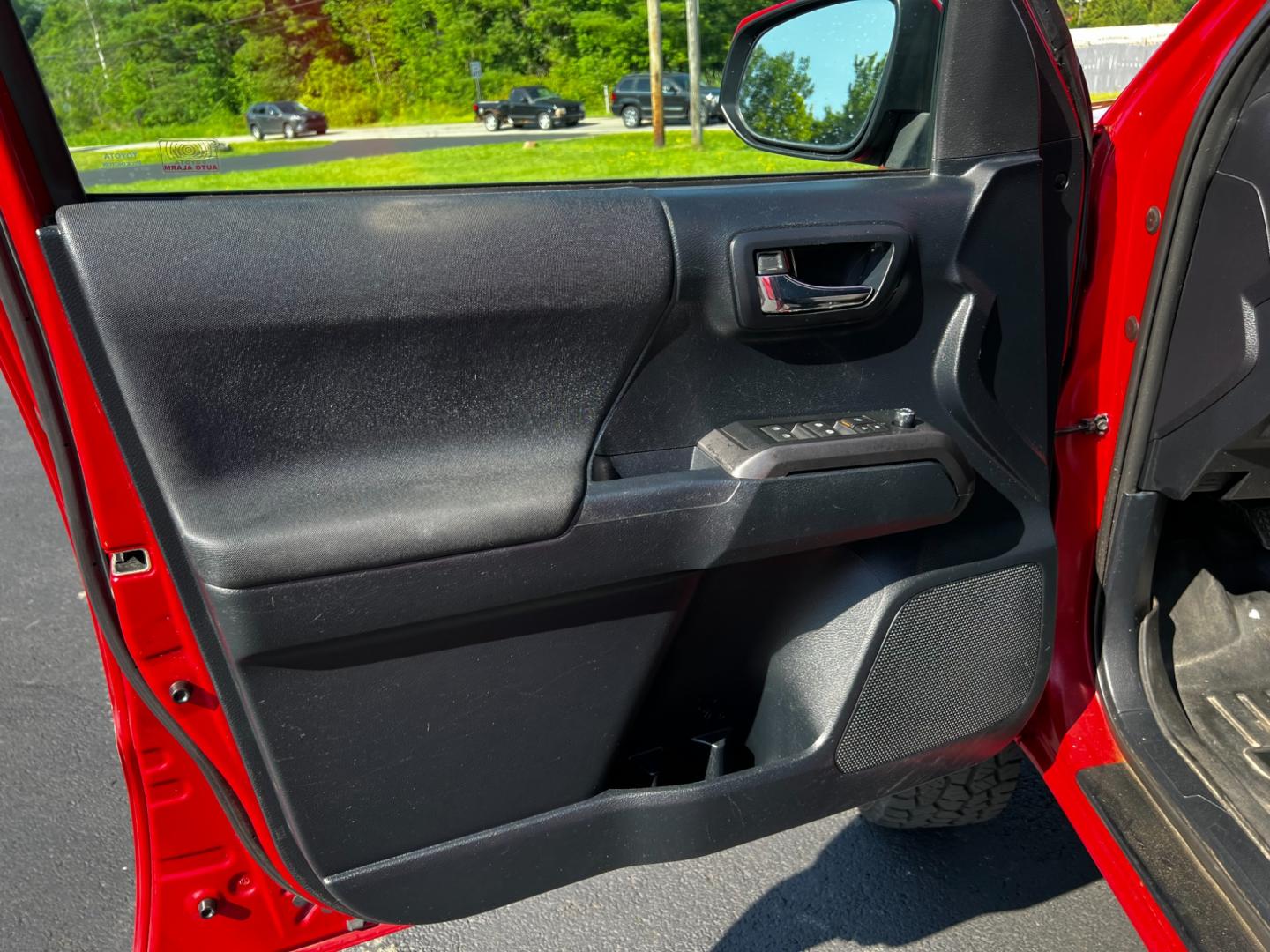 2016 Red /Black Toyota Tacoma TRD Sport Double Cab Short Bed V6 6M 4WD (5TFCZ5AN3GX) with an 3.6L V6 DOHC 24V engine, 6 Speed Manual transmission, located at 11115 Chardon Rd. , Chardon, OH, 44024, (440) 214-9705, 41.580246, -81.241943 - This 2016 Toyota Tacoma TRD Sport Double Cab is a well-equipped mid-size pickup truck that offers a blend of performance, technology, and utility. It features a powerful 3.5-liter Atkinson cycle V6 engine paired with a 6-speed manual transmission, providing a balance of power and efficiency with a h - Photo#22