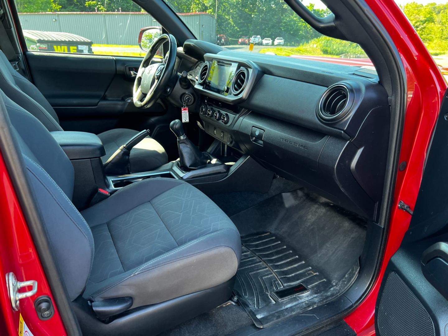 2016 Red /Black Toyota Tacoma TRD Sport Double Cab Short Bed V6 6M 4WD (5TFCZ5AN3GX) with an 3.6L V6 DOHC 24V engine, 6 Speed Manual transmission, located at 11115 Chardon Rd. , Chardon, OH, 44024, (440) 214-9705, 41.580246, -81.241943 - This 2016 Toyota Tacoma TRD Sport Double Cab is a well-equipped mid-size pickup truck that offers a blend of performance, technology, and utility. It features a powerful 3.5-liter Atkinson cycle V6 engine paired with a 6-speed manual transmission, providing a balance of power and efficiency with a h - Photo#41