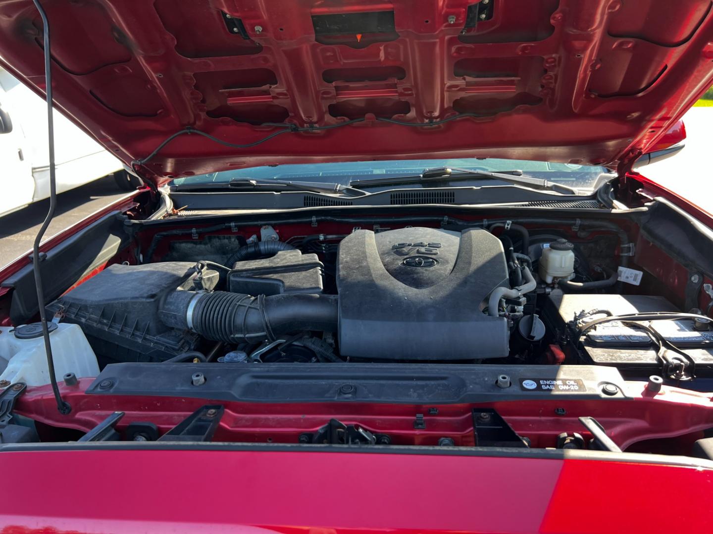 2016 Red /Black Toyota Tacoma TRD Sport Double Cab Short Bed V6 6M 4WD (5TFCZ5AN3GX) with an 3.6L V6 DOHC 24V engine, 6 Speed Manual transmission, located at 11115 Chardon Rd. , Chardon, OH, 44024, (440) 214-9705, 41.580246, -81.241943 - This 2016 Toyota Tacoma TRD Sport Double Cab is a well-equipped mid-size pickup truck that offers a blend of performance, technology, and utility. It features a powerful 3.5-liter Atkinson cycle V6 engine paired with a 6-speed manual transmission, providing a balance of power and efficiency with a h - Photo#19