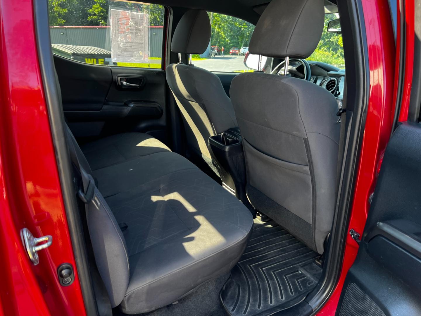 2016 Red /Black Toyota Tacoma TRD Sport Double Cab Short Bed V6 6M 4WD (5TFCZ5AN3GX) with an 3.6L V6 DOHC 24V engine, 6 Speed Manual transmission, located at 11115 Chardon Rd. , Chardon, OH, 44024, (440) 214-9705, 41.580246, -81.241943 - This 2016 Toyota Tacoma TRD Sport Double Cab is a well-equipped mid-size pickup truck that offers a blend of performance, technology, and utility. It features a powerful 3.5-liter Atkinson cycle V6 engine paired with a 6-speed manual transmission, providing a balance of power and efficiency with a h - Photo#39