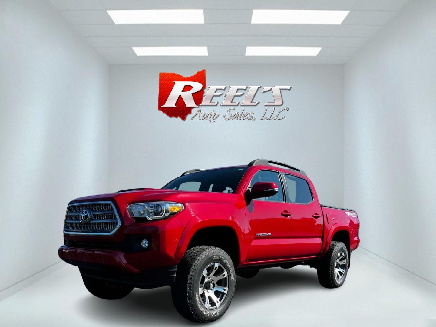 2016 Red /Black Toyota Tacoma TRD Sport Double Cab Short Bed V6 6M 4WD (5TFCZ5AN3GX) with an 3.6L V6 DOHC 24V engine, 6 Speed Manual transmission, located at 11115 Chardon Rd. , Chardon, OH, 44024, (440) 214-9705, 41.580246, -81.241943 - This 2016 Toyota Tacoma TRD Sport Double Cab is a well-equipped mid-size pickup truck that offers a blend of performance, technology, and utility. It features a powerful 3.5-liter Atkinson cycle V6 engine paired with a 6-speed manual transmission, providing a balance of power and efficiency with a h - Photo#0