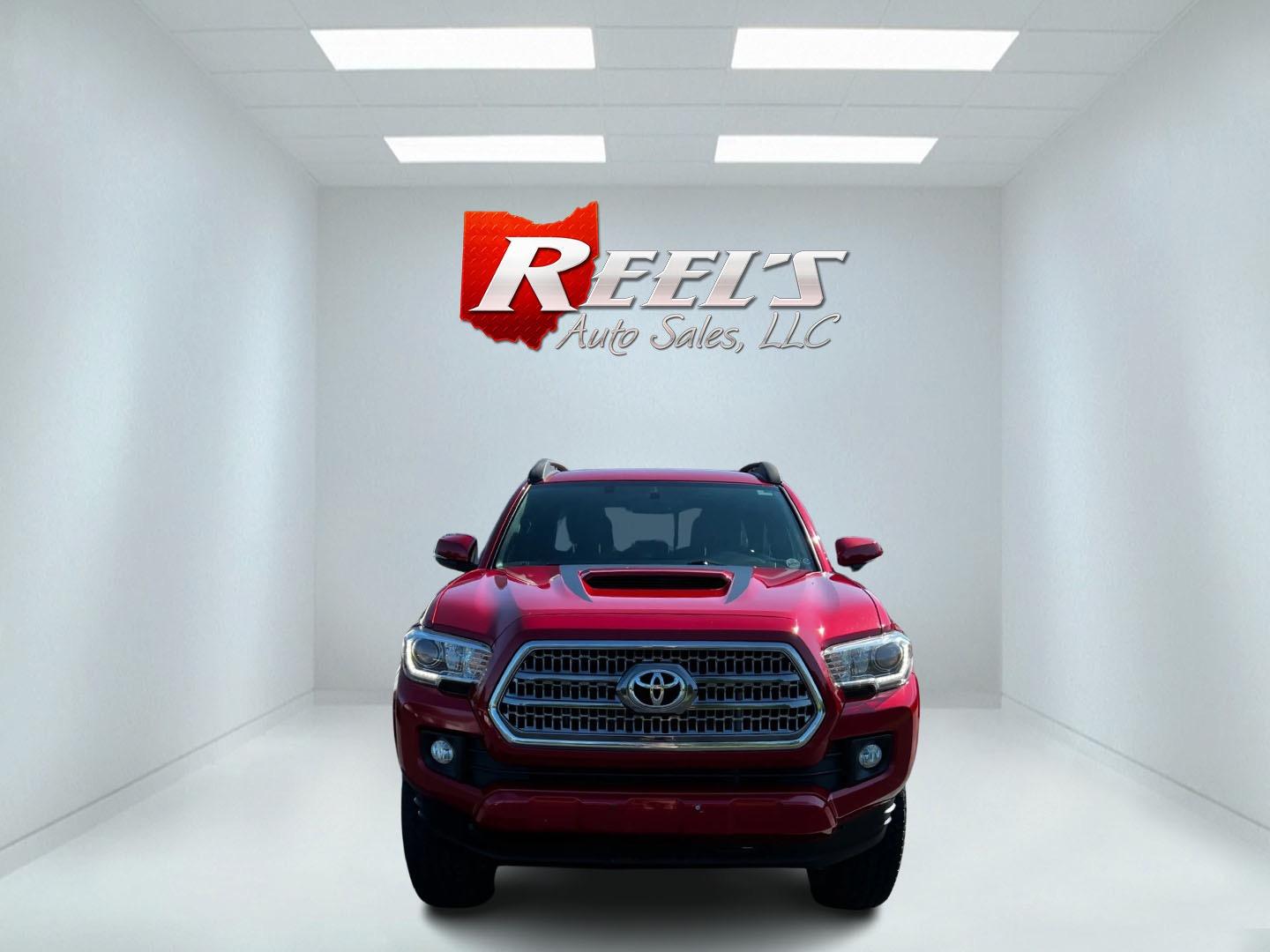 2016 Red /Black Toyota Tacoma TRD Sport Double Cab Short Bed V6 6M 4WD (5TFCZ5AN3GX) with an 3.6L V6 DOHC 24V engine, 6 Speed Manual transmission, located at 11115 Chardon Rd. , Chardon, OH, 44024, (440) 214-9705, 41.580246, -81.241943 - This 2016 Toyota Tacoma TRD Sport Double Cab is a well-equipped mid-size pickup truck that offers a blend of performance, technology, and utility. It features a powerful 3.5-liter Atkinson cycle V6 engine paired with a 6-speed manual transmission, providing a balance of power and efficiency with a h - Photo#1