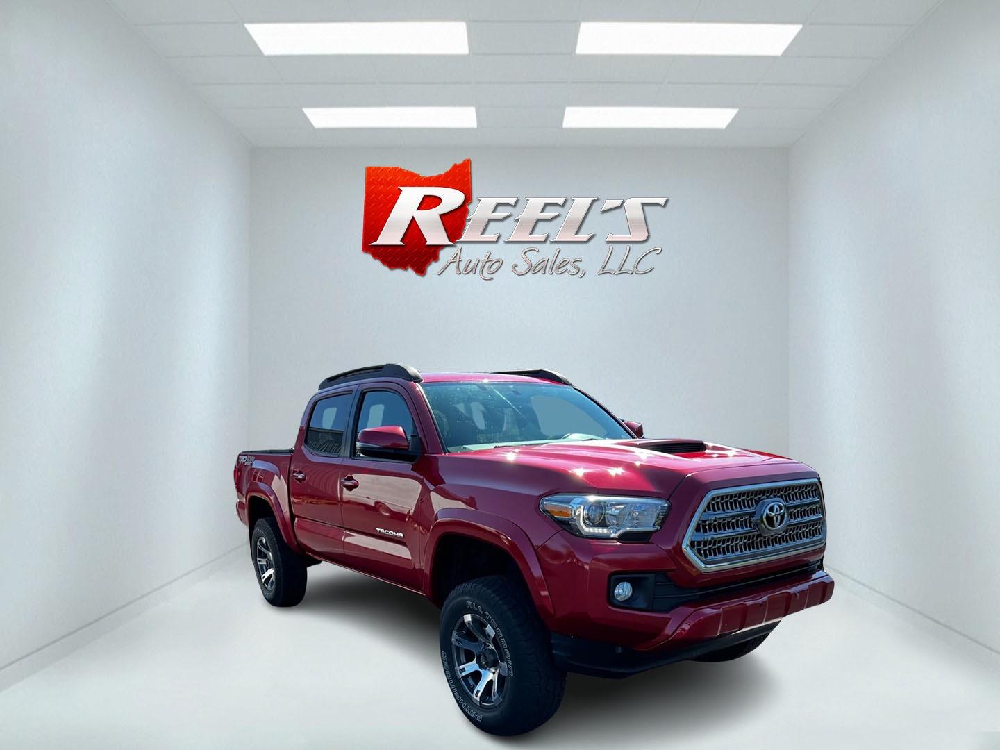 2016 Red /Black Toyota Tacoma TRD Sport Double Cab Short Bed V6 6M 4WD (5TFCZ5AN3GX) with an 3.6L V6 DOHC 24V engine, 6 Speed Manual transmission, located at 11115 Chardon Rd. , Chardon, OH, 44024, (440) 214-9705, 41.580246, -81.241943 - This 2016 Toyota Tacoma TRD Sport Double Cab is a well-equipped mid-size pickup truck that offers a blend of performance, technology, and utility. It features a powerful 3.5-liter Atkinson cycle V6 engine paired with a 6-speed manual transmission, providing a balance of power and efficiency with a h - Photo#2