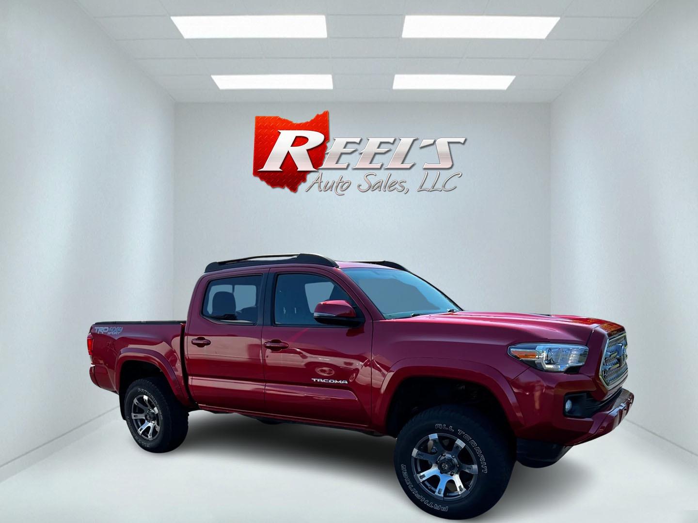 2016 Red /Black Toyota Tacoma TRD Sport Double Cab Short Bed V6 6M 4WD (5TFCZ5AN3GX) with an 3.6L V6 DOHC 24V engine, 6 Speed Manual transmission, located at 11115 Chardon Rd. , Chardon, OH, 44024, (440) 214-9705, 41.580246, -81.241943 - This 2016 Toyota Tacoma TRD Sport Double Cab is a well-equipped mid-size pickup truck that offers a blend of performance, technology, and utility. It features a powerful 3.5-liter Atkinson cycle V6 engine paired with a 6-speed manual transmission, providing a balance of power and efficiency with a h - Photo#3