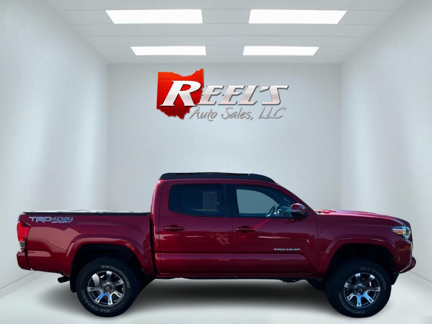 2016 Red /Black Toyota Tacoma TRD Sport Double Cab Short Bed V6 6M 4WD (5TFCZ5AN3GX) with an 3.6L V6 DOHC 24V engine, 6 Speed Manual transmission, located at 11115 Chardon Rd. , Chardon, OH, 44024, (440) 214-9705, 41.580246, -81.241943 - This 2016 Toyota Tacoma TRD Sport Double Cab is a well-equipped mid-size pickup truck that offers a blend of performance, technology, and utility. It features a powerful 3.5-liter Atkinson cycle V6 engine paired with a 6-speed manual transmission, providing a balance of power and efficiency with a h - Photo#4