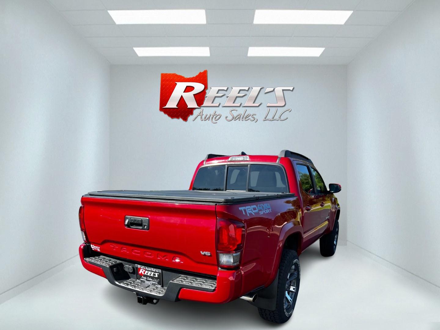 2016 Red /Black Toyota Tacoma TRD Sport Double Cab Short Bed V6 6M 4WD (5TFCZ5AN3GX) with an 3.6L V6 DOHC 24V engine, 6 Speed Manual transmission, located at 11115 Chardon Rd. , Chardon, OH, 44024, (440) 214-9705, 41.580246, -81.241943 - This 2016 Toyota Tacoma TRD Sport Double Cab is a well-equipped mid-size pickup truck that offers a blend of performance, technology, and utility. It features a powerful 3.5-liter Atkinson cycle V6 engine paired with a 6-speed manual transmission, providing a balance of power and efficiency with a h - Photo#5