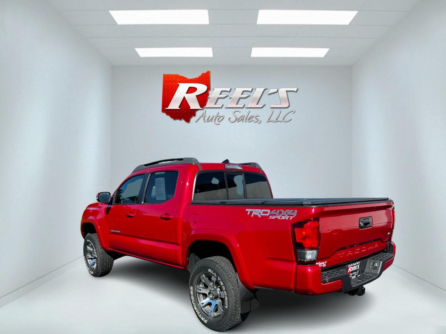 2016 Red /Black Toyota Tacoma TRD Sport Double Cab Short Bed V6 6M 4WD (5TFCZ5AN3GX) with an 3.6L V6 DOHC 24V engine, 6 Speed Manual transmission, located at 11115 Chardon Rd. , Chardon, OH, 44024, (440) 214-9705, 41.580246, -81.241943 - This 2016 Toyota Tacoma TRD Sport Double Cab is a well-equipped mid-size pickup truck that offers a blend of performance, technology, and utility. It features a powerful 3.5-liter Atkinson cycle V6 engine paired with a 6-speed manual transmission, providing a balance of power and efficiency with a h - Photo#7