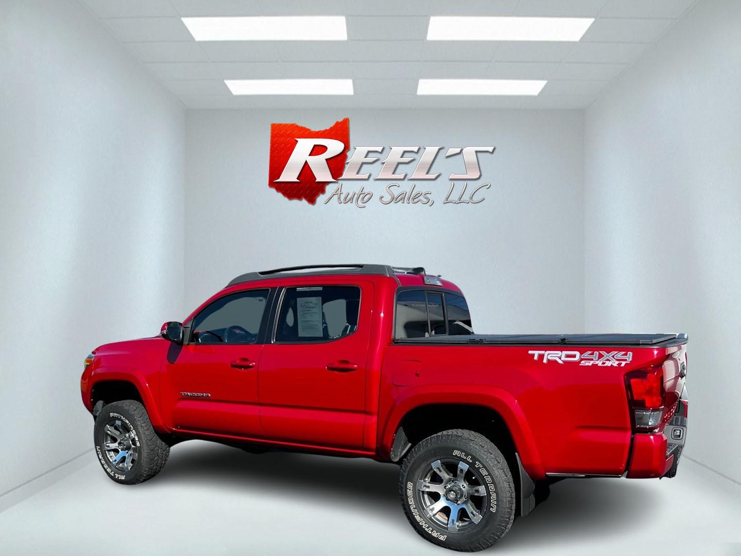 2016 Red /Black Toyota Tacoma TRD Sport Double Cab Short Bed V6 6M 4WD (5TFCZ5AN3GX) with an 3.6L V6 DOHC 24V engine, 6 Speed Manual transmission, located at 11115 Chardon Rd. , Chardon, OH, 44024, (440) 214-9705, 41.580246, -81.241943 - This 2016 Toyota Tacoma TRD Sport Double Cab is a well-equipped mid-size pickup truck that offers a blend of performance, technology, and utility. It features a powerful 3.5-liter Atkinson cycle V6 engine paired with a 6-speed manual transmission, providing a balance of power and efficiency with a h - Photo#8