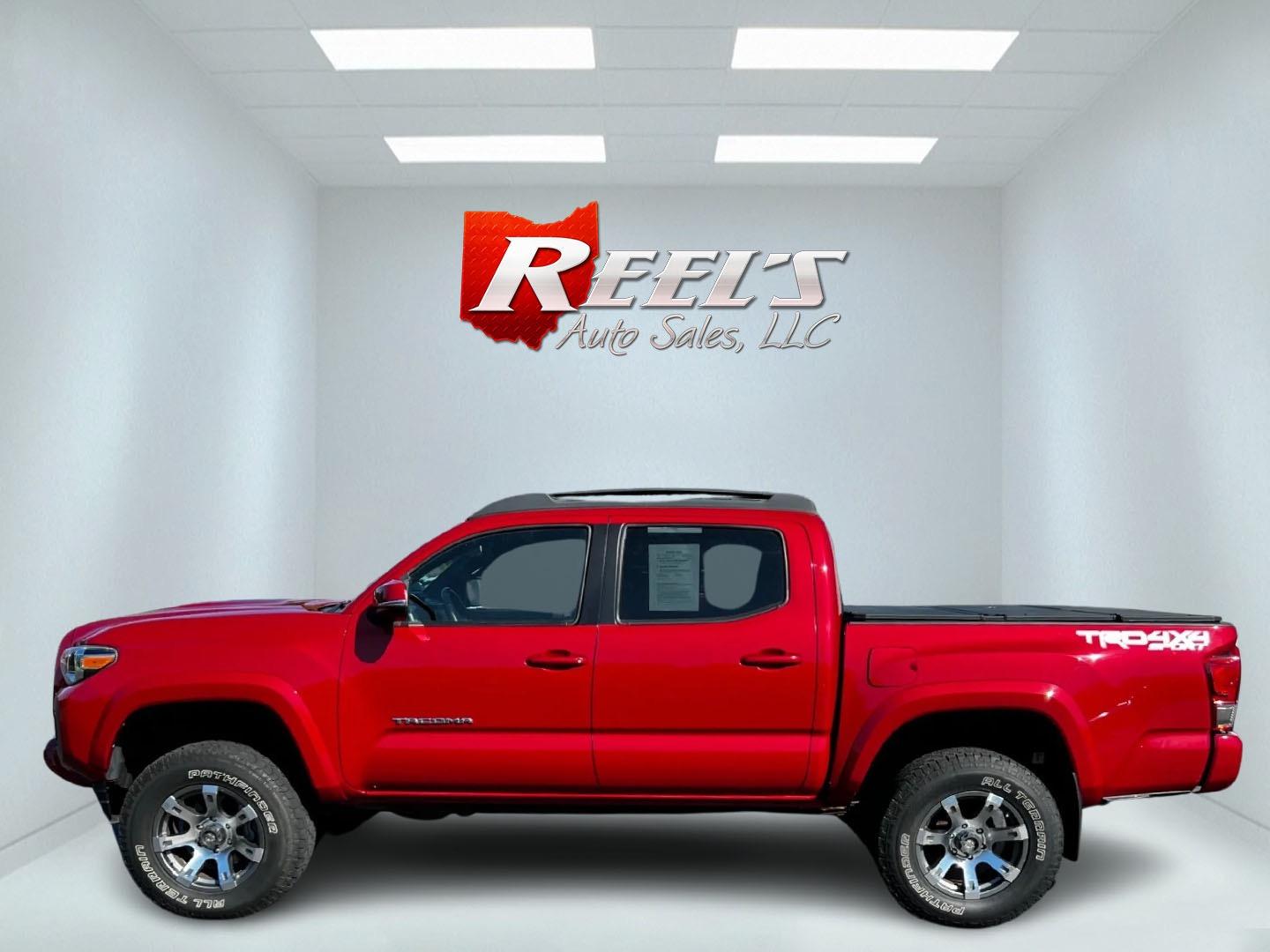 2016 Red /Black Toyota Tacoma TRD Sport Double Cab Short Bed V6 6M 4WD (5TFCZ5AN3GX) with an 3.6L V6 DOHC 24V engine, 6 Speed Manual transmission, located at 11115 Chardon Rd. , Chardon, OH, 44024, (440) 214-9705, 41.580246, -81.241943 - This 2016 Toyota Tacoma TRD Sport Double Cab is a well-equipped mid-size pickup truck that offers a blend of performance, technology, and utility. It features a powerful 3.5-liter Atkinson cycle V6 engine paired with a 6-speed manual transmission, providing a balance of power and efficiency with a h - Photo#9