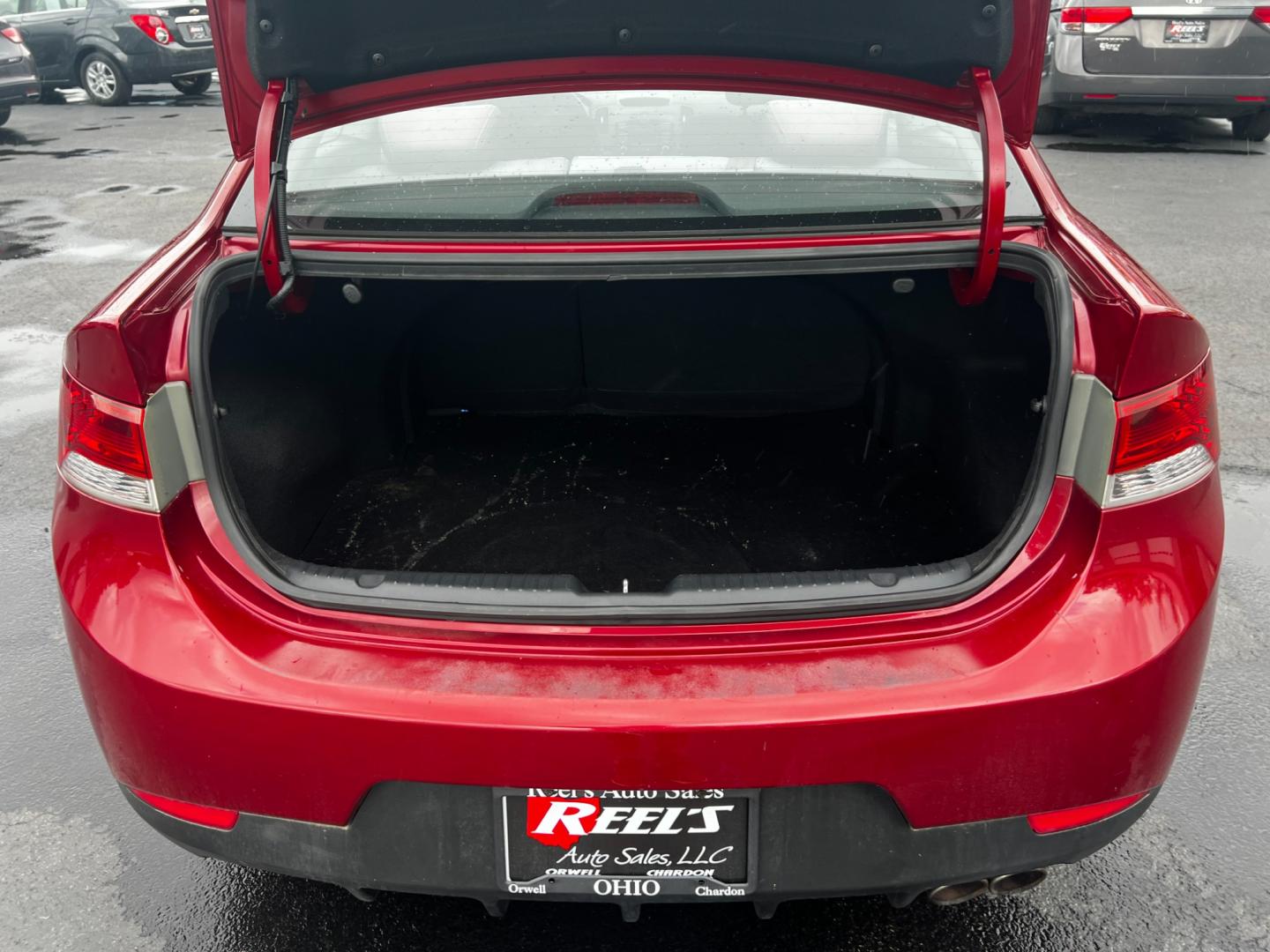 2010 Red /Black Kia Forte Koup EX (KNAFU6A29A5) with an 2.0L I4 DOHC 16V engine, 4 Speed Auto transmission, located at 547 E. Main St., Orwell, OH, 44076, (440) 437-5893, 41.535435, -80.847855 - Photo#26