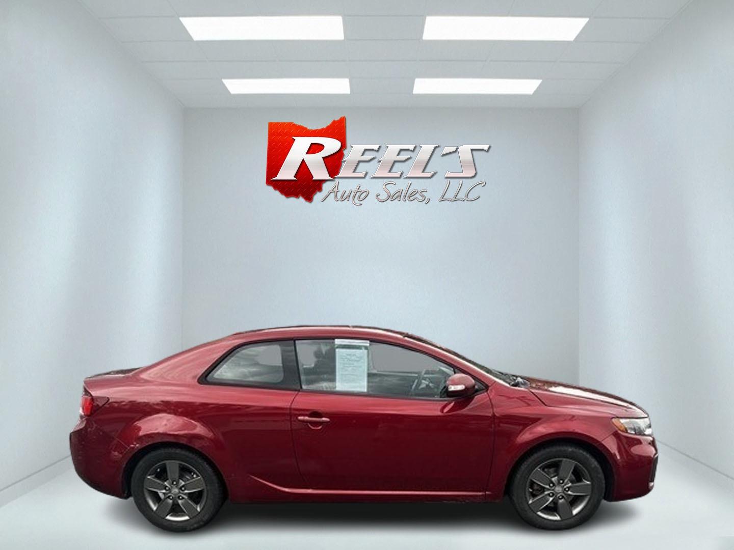 2010 Red /Black Kia Forte Koup EX (KNAFU6A29A5) with an 2.0L I4 DOHC 16V engine, 4 Speed Auto transmission, located at 547 E. Main St., Orwell, OH, 44076, (440) 437-5893, 41.535435, -80.847855 - Photo#4
