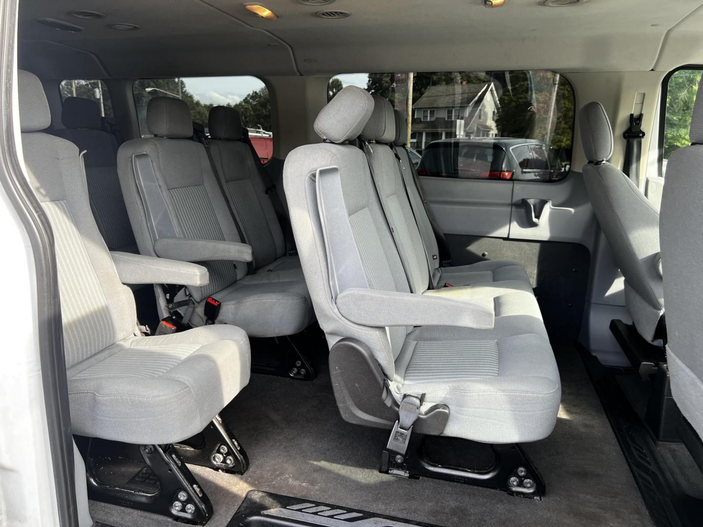 2016 White /Black Ford Transit 350 Wagon Low Roof XLT 60/40 Pass. 148-in. WB (1FBZX2ZM6GK) with an 3.7L V6 DOHC 24V engine, 6 Speed Auto transmission, located at 547 E. Main St., Orwell, OH, 44076, (440) 437-5893, 41.535435, -80.847855 - This 2016 Ford Transit T-350 XLT Wagon is a versatile 13-passenger van equipped with a 3.7-liter V6 engine and a 6-speed automatic transmission. This model offers a comfortable ride with front and rear climate zones and features modern conveniences such as HD radio, and dusk-sensing headlights. Safe - Photo#32