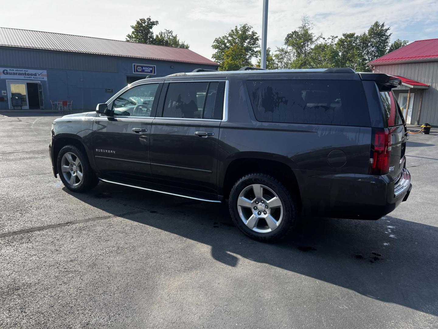 2017 Gray /Black Chevrolet Suburban Premier 4WD (1GNSKJKCXHR) with an 5.3L V8 OHV 16V engine, 6-Speed Automatic transmission, located at 547 E. Main St., Orwell, OH, 44076, (440) 437-5893, 41.535435, -80.847855 - Photo#12