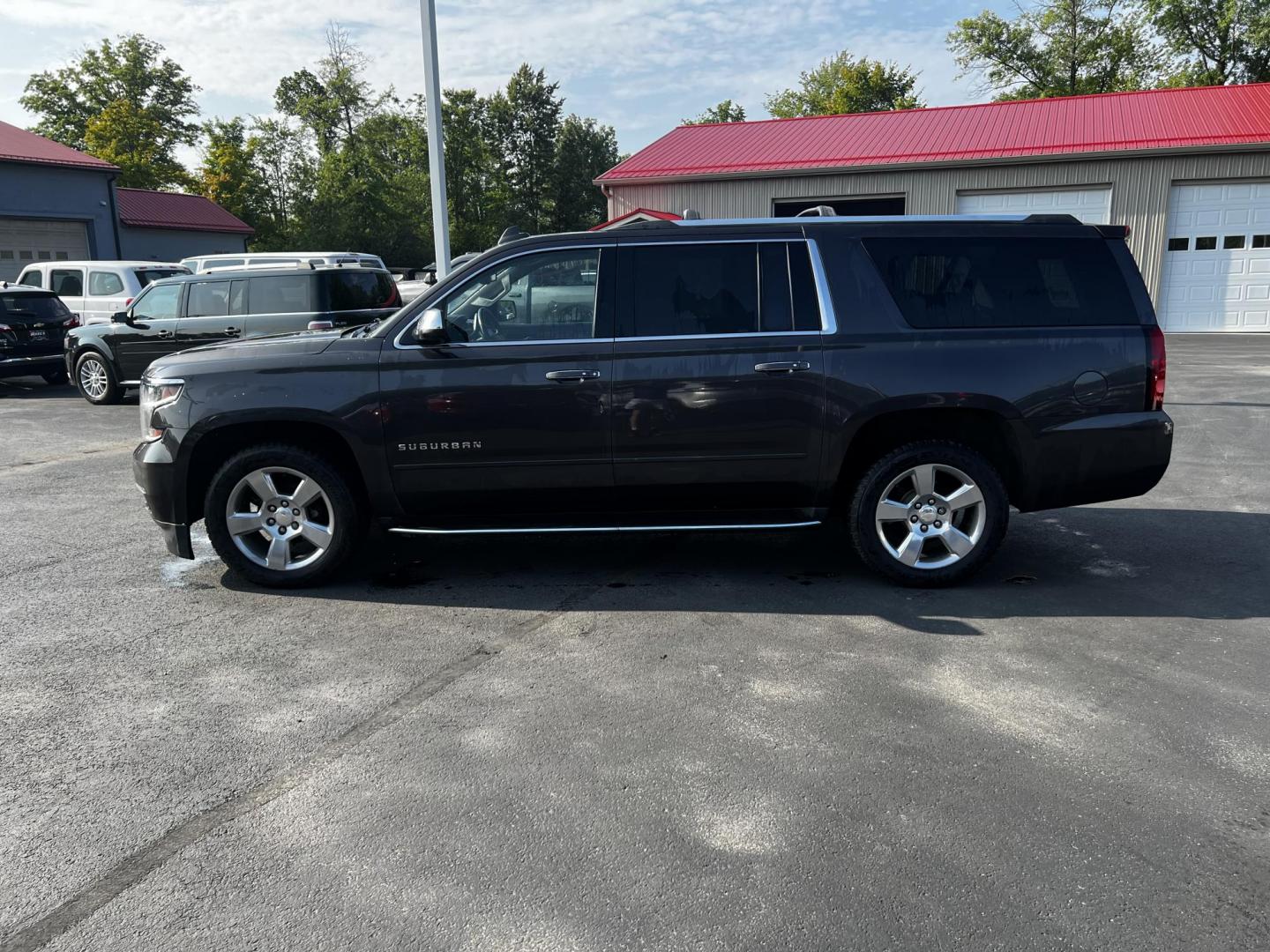 2017 Gray /Black Chevrolet Suburban Premier 4WD (1GNSKJKCXHR) with an 5.3L V8 OHV 16V engine, 6-Speed Automatic transmission, located at 547 E. Main St., Orwell, OH, 44076, (440) 437-5893, 41.535435, -80.847855 - Photo#16
