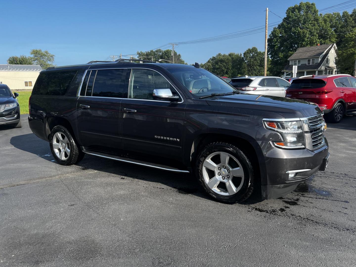 2017 Gray /Black Chevrolet Suburban Premier 4WD (1GNSKJKCXHR) with an 5.3L V8 OHV 16V engine, 6-Speed Automatic transmission, located at 547 E. Main St., Orwell, OH, 44076, (440) 437-5893, 41.535435, -80.847855 - Photo#3